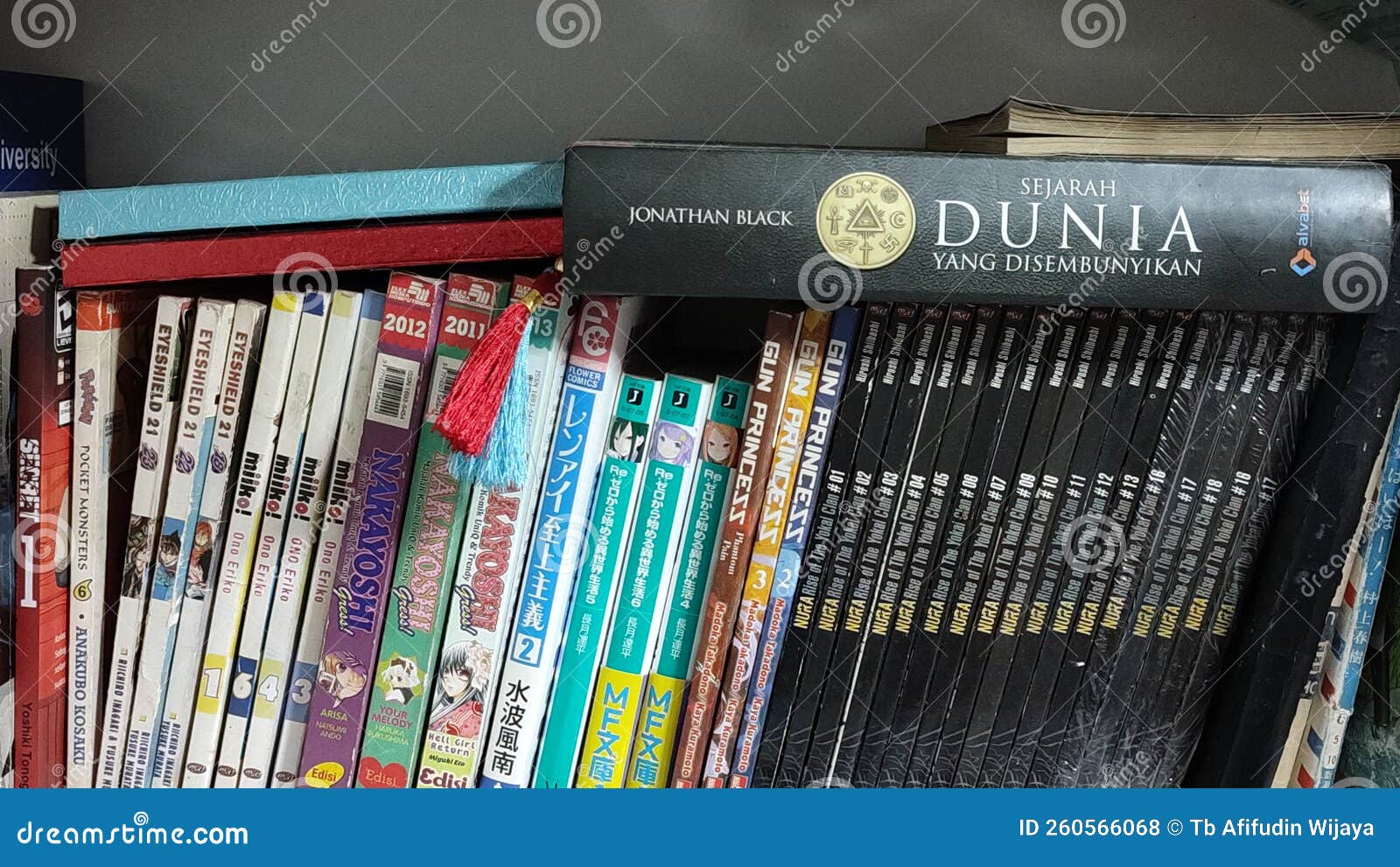 Various Comics and Books Placed on the Bookshelf Stock Photo Image of