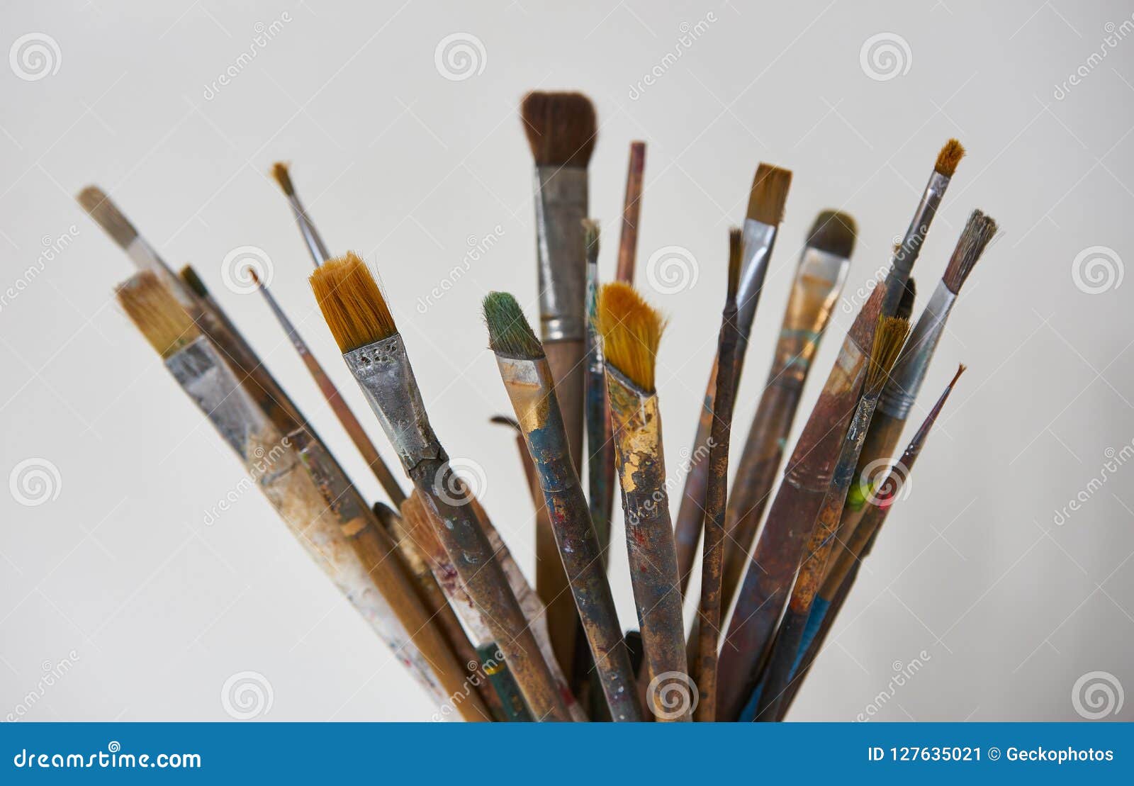 Paint brushes with gouache in cup isolated on white Stock Photo