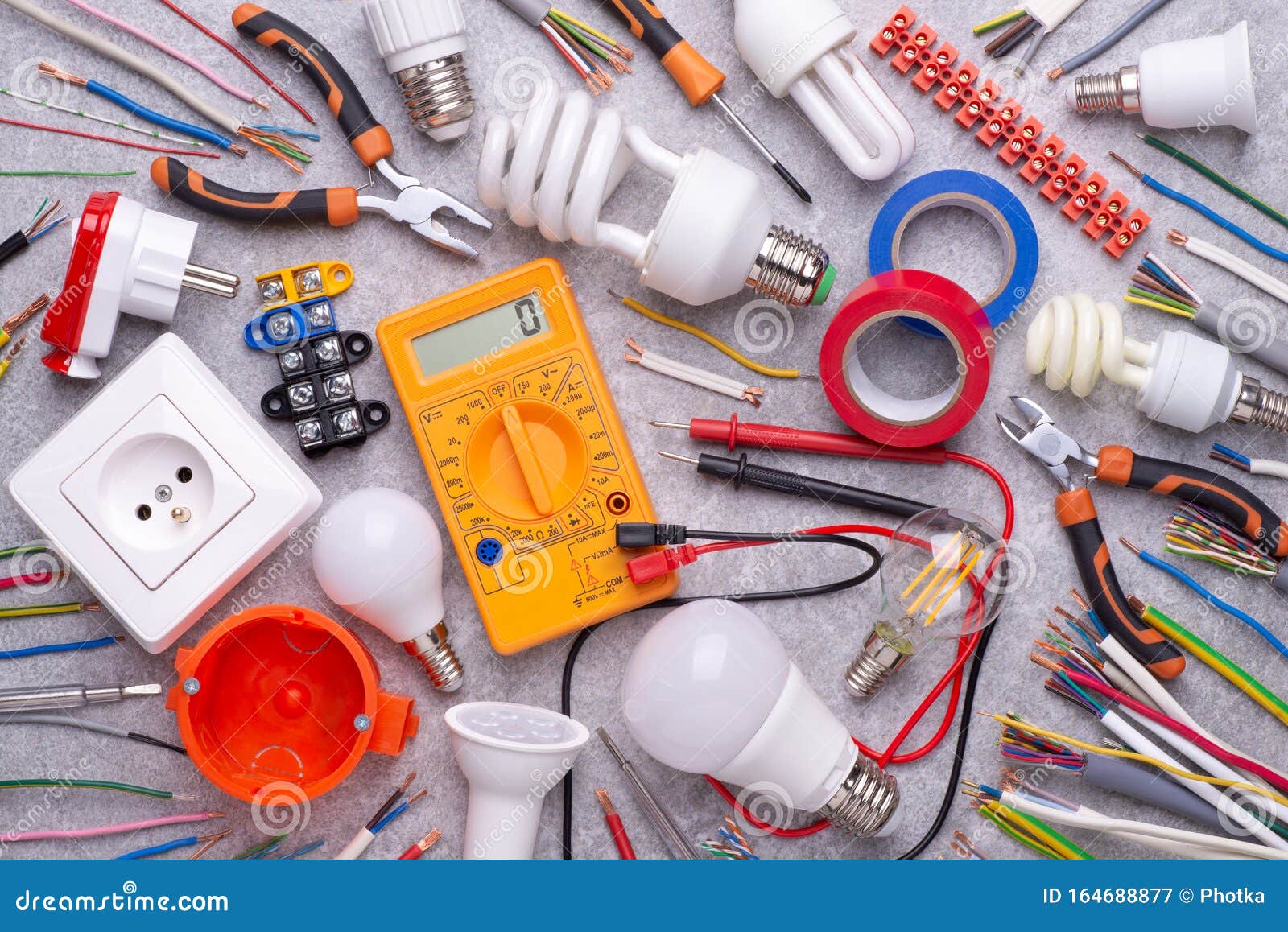 electrician equipment on metalic background, top view