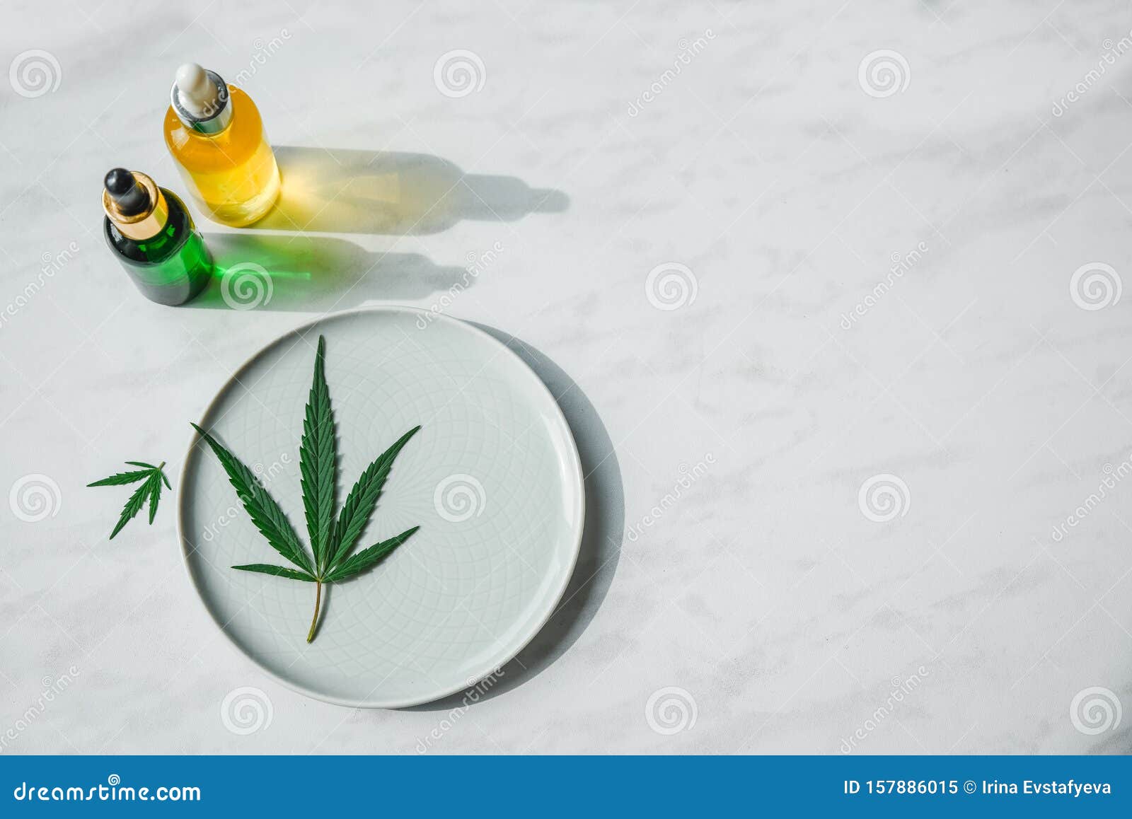 Glass Bottles With CBD Oil, THC Tincture And Hemp Leaves ...