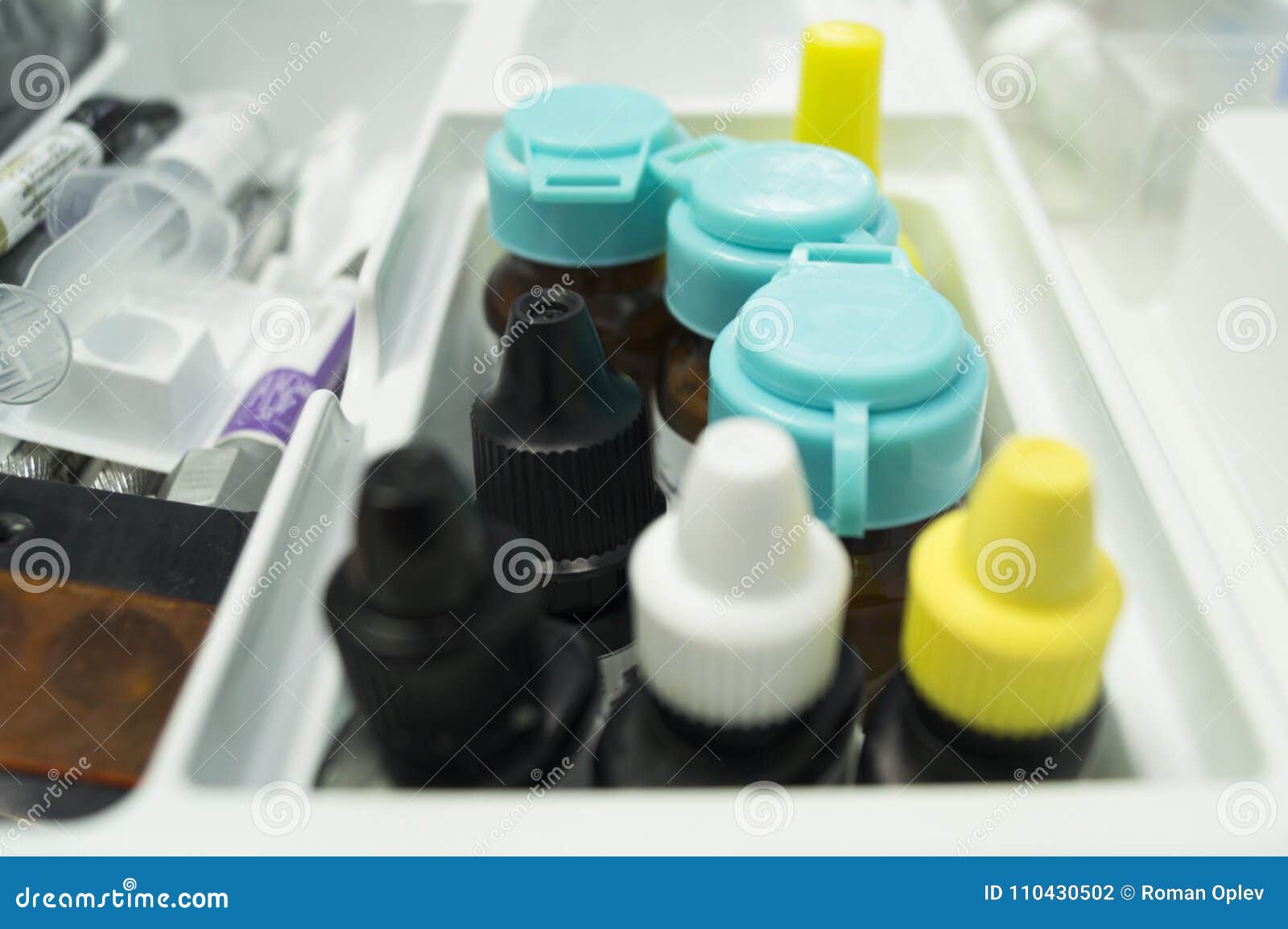Various Instruments, Medications and Painkillers in a Dentist`s Support