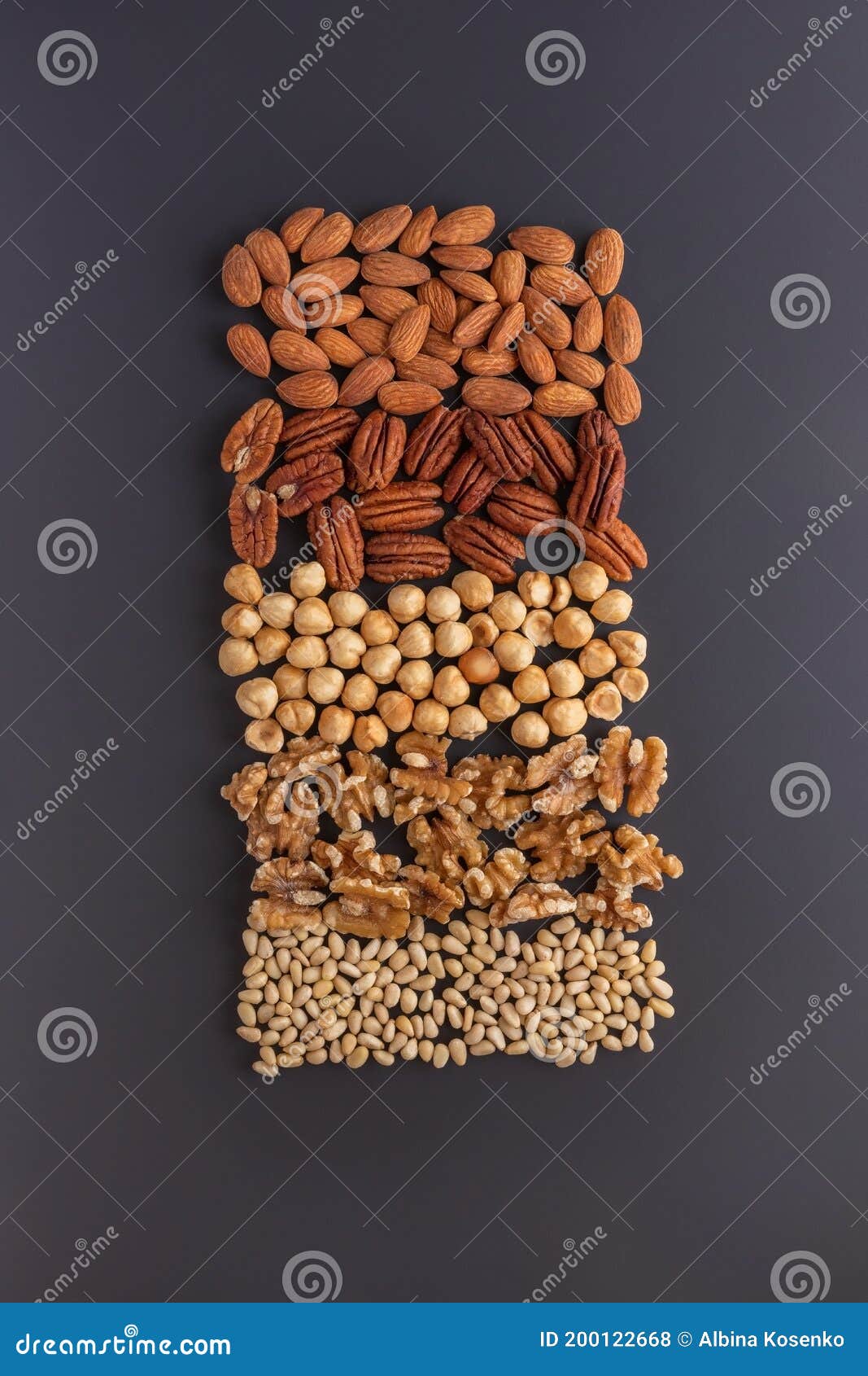 Various Nuts, a Good Source of Protein, Arranged on the Grey Table