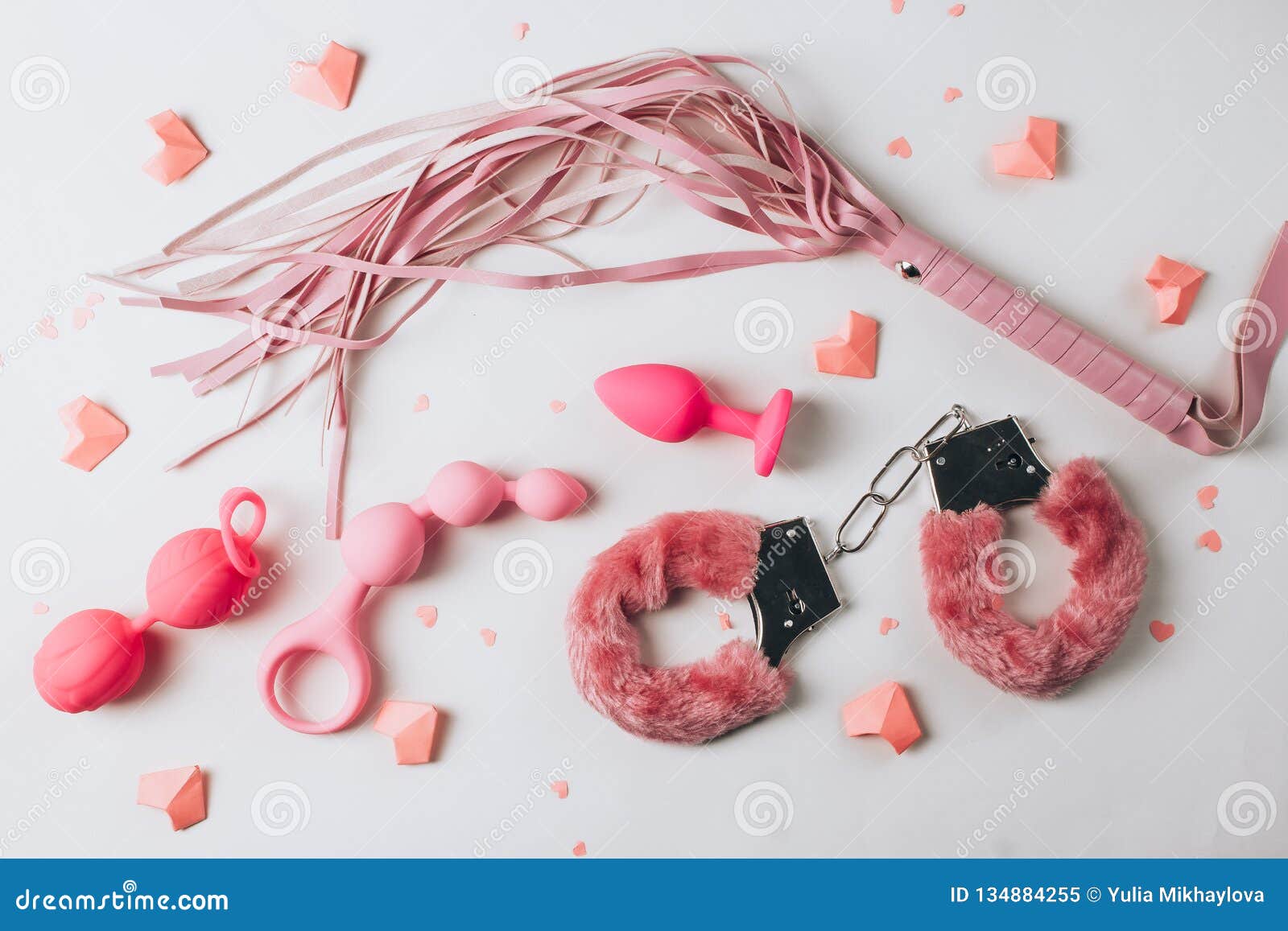 Various Pink Sex Toys Are Arranged On A White Background Stock Image