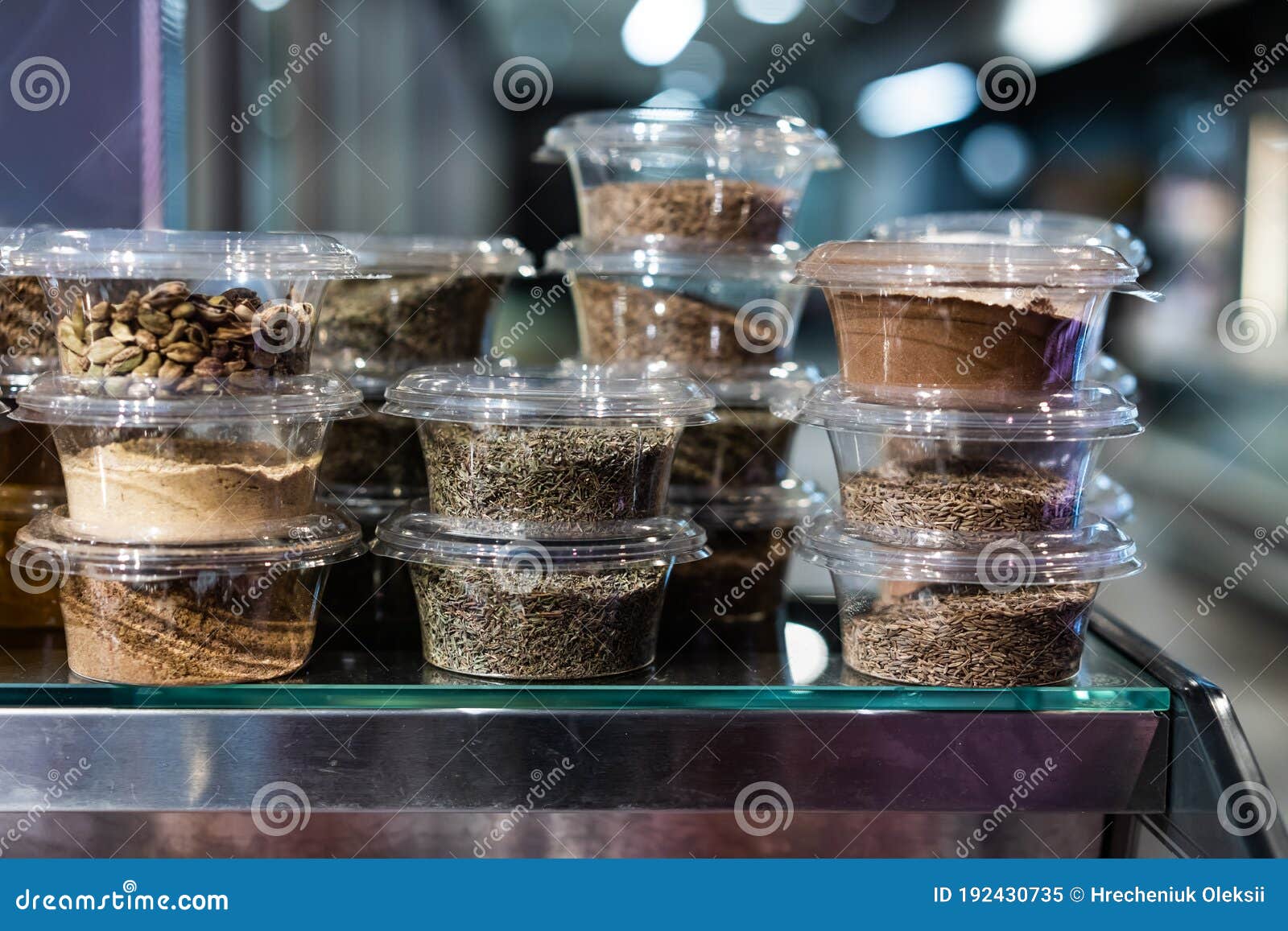 Various Spices and Herbs Packed in Small Transparent Plastic Boxes