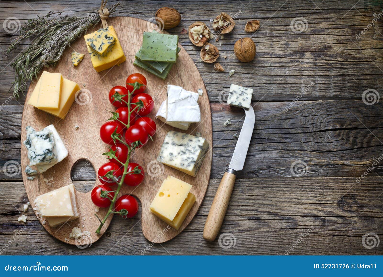Various Types of Cheese on Abstract Vintage Paint Palette Stock Photo