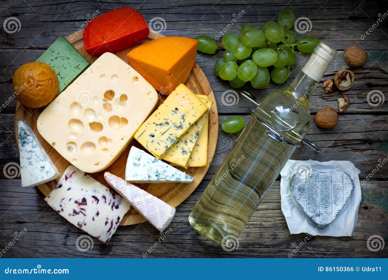 Various Types of Cheese with Bottle of Wine on Old Retro Boards Still