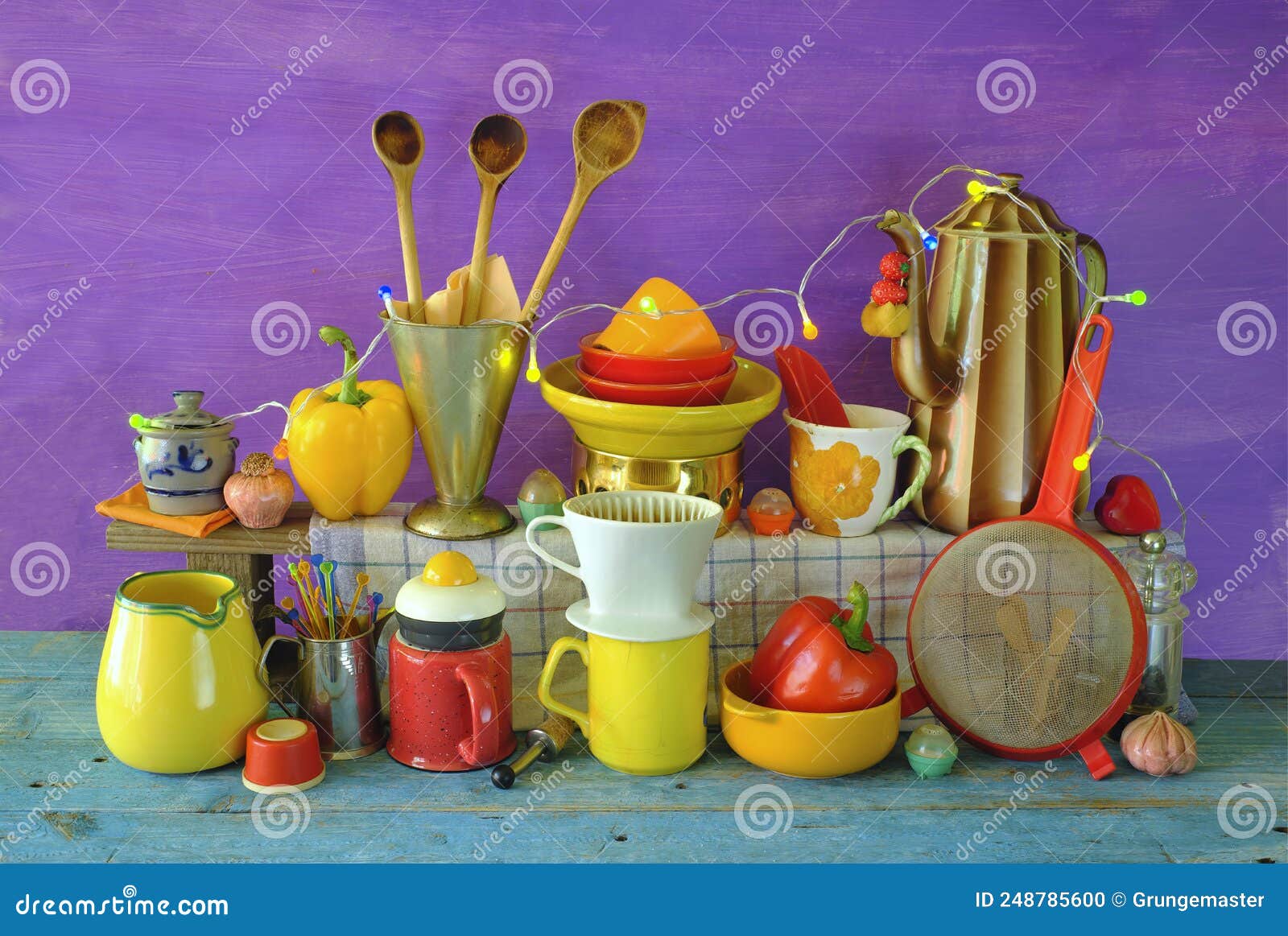 various vintage kitchen utensils from the seventies with vibrant colors, pop and trashy style kitchen still life