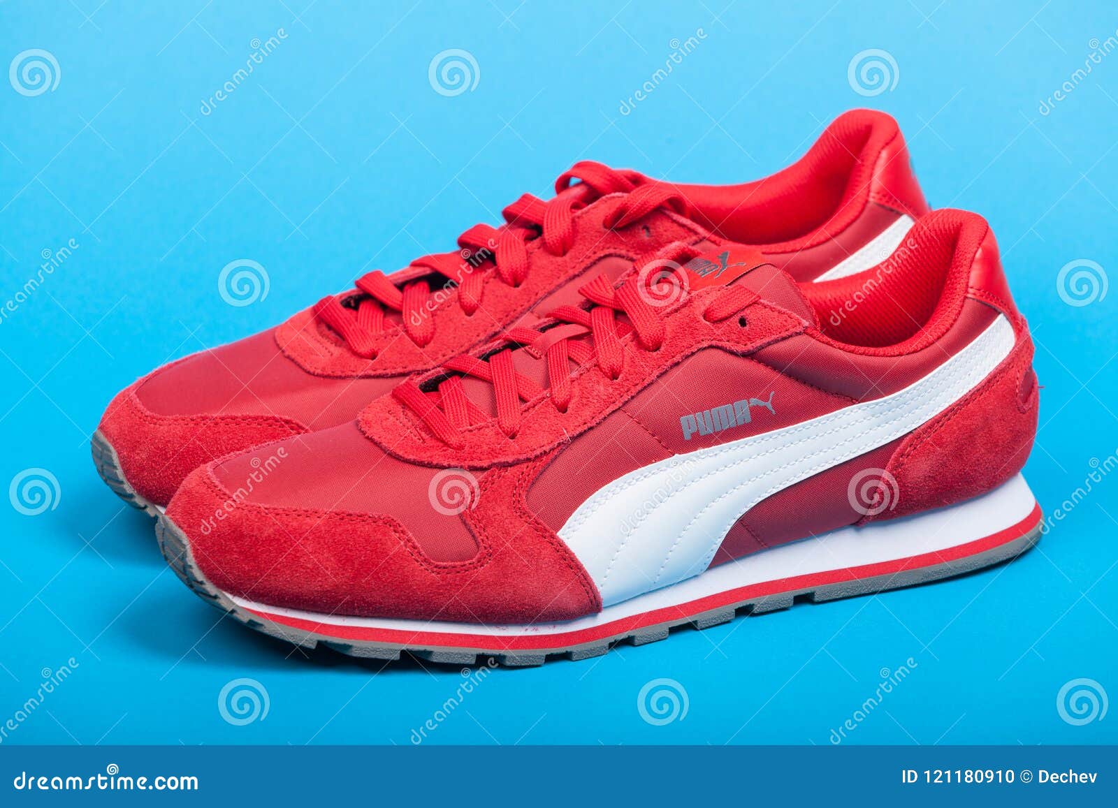 Varna , Bulgaria JUNE 17, 2017. Red PUMA Shoes on Blue Background. Puma, a Major German Multinational Company Editorial Image - Image of sign, sports: 121180910