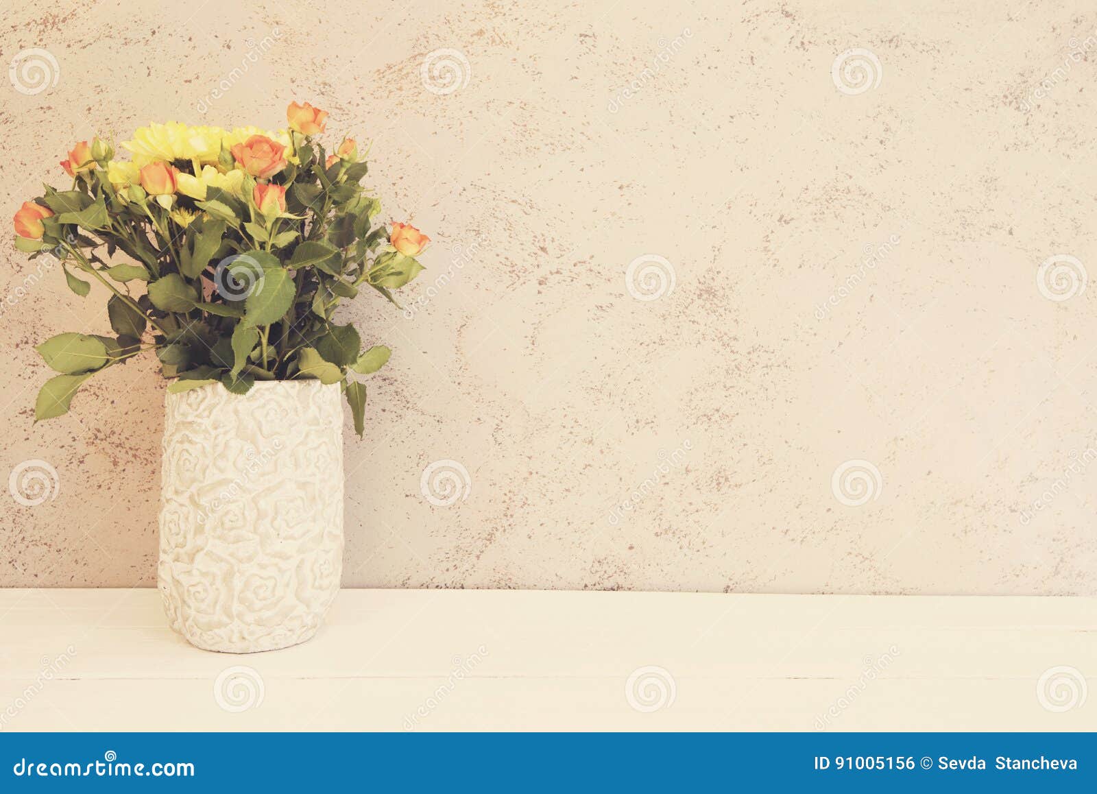 vase of flowers. rustic vase with orange roses and yellow chrysanthemums. white background, empty place, copy space. vintage tinte