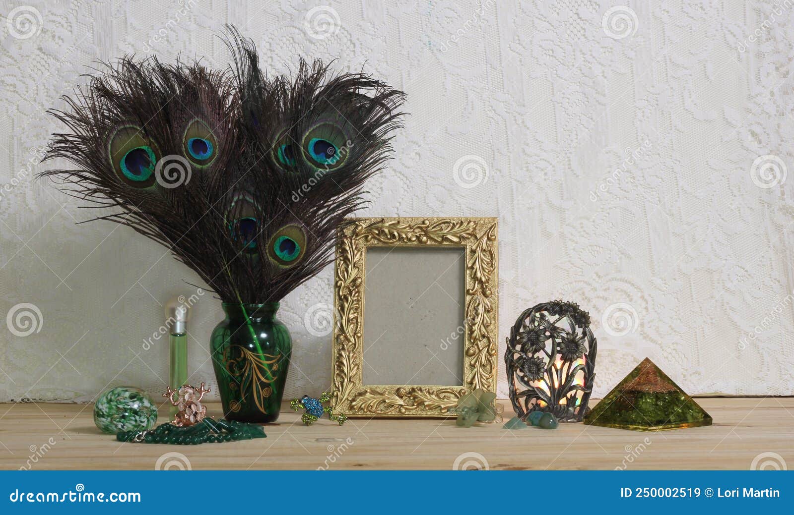 Vase of Peacock Feathers with Green Jewelry and Gold Photo Frame ...