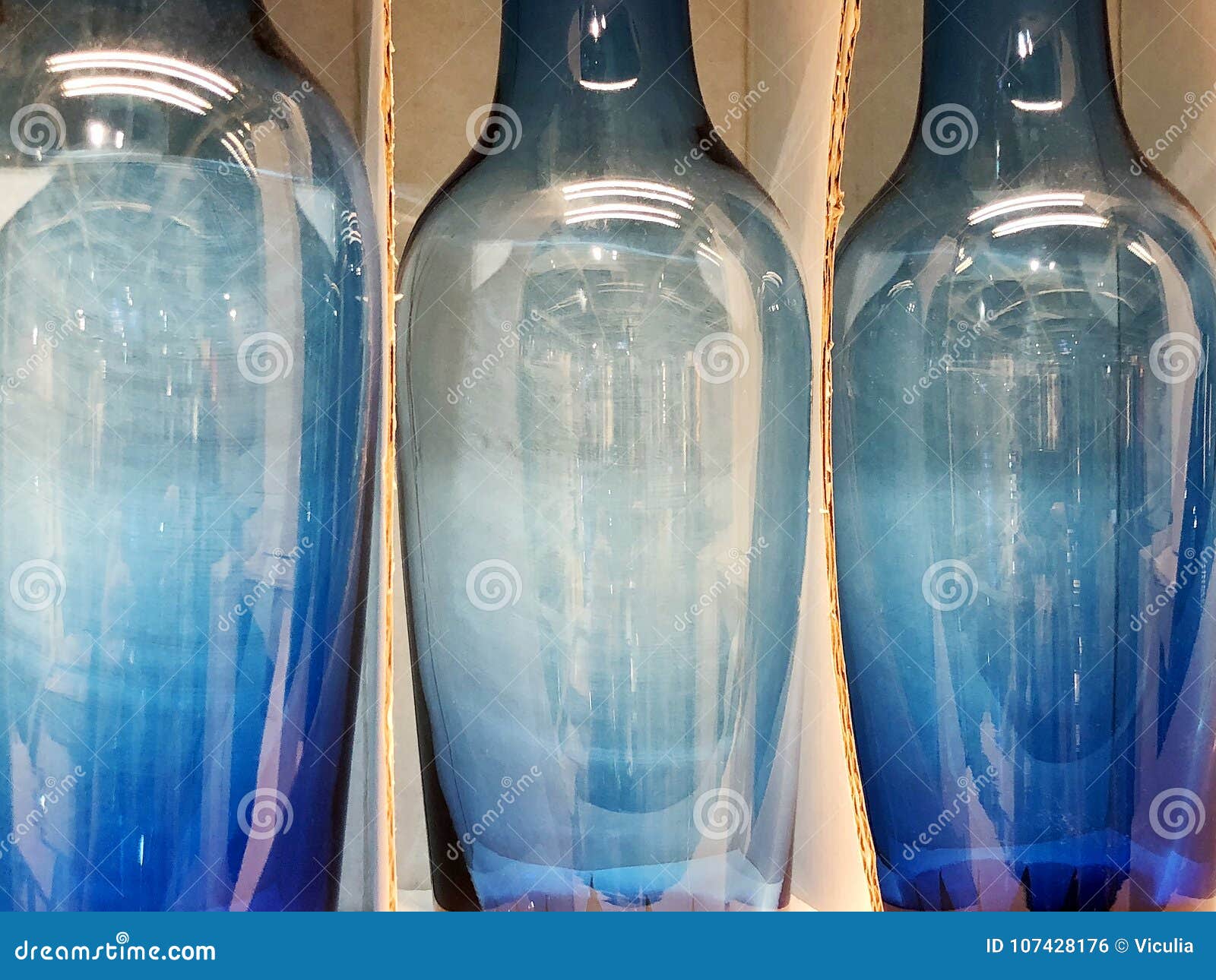 Vases are Decorative Blue Containers in the Interior of the Room. Stock
