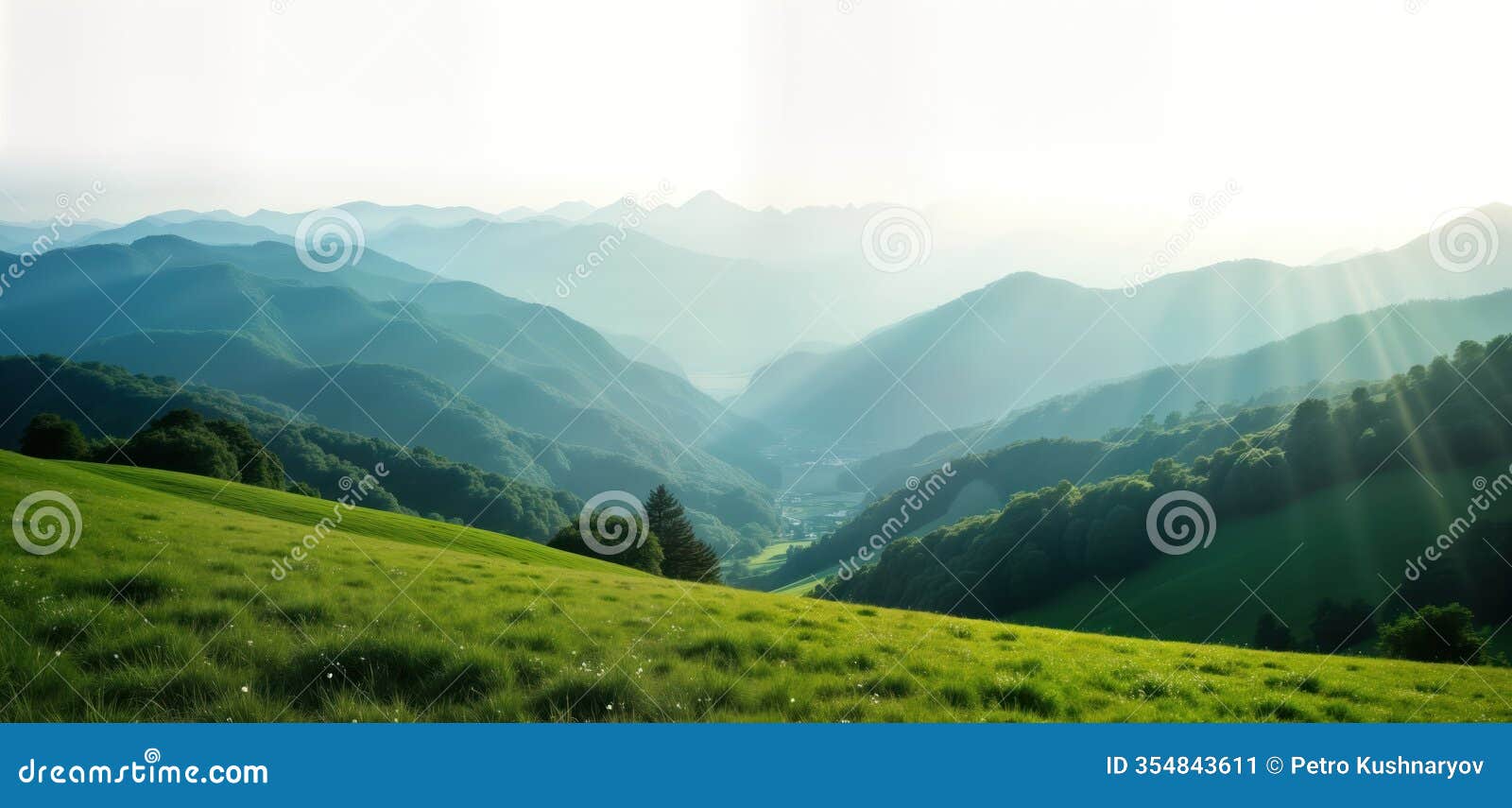 vast green valley landscape extends to distant mountain range. sunlight streams through mist. foliage covers slopes. peaceful