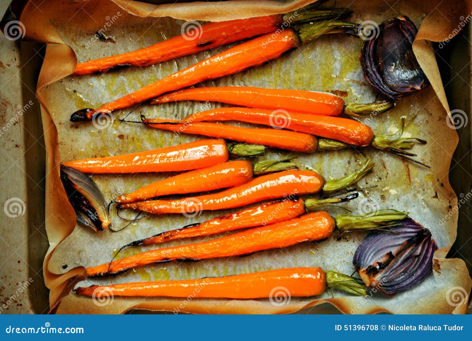 vegan food with carrots and onion grilled in the oven