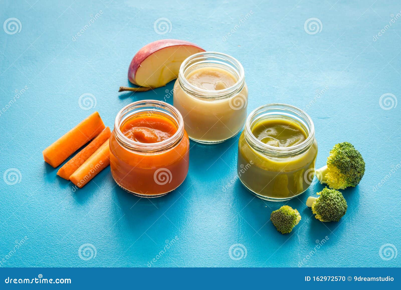 Vegetable and Fruits Puree for Feed Babies on Blue Background Stock