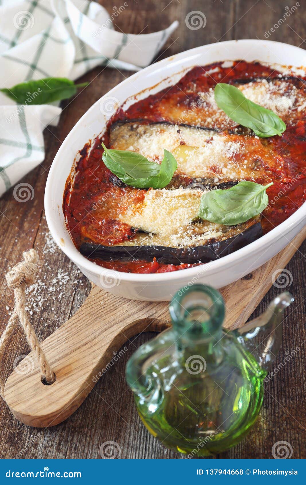 Vegetable Gratin. Baked Eggplants in Tomato Sauce with Grated Cheese