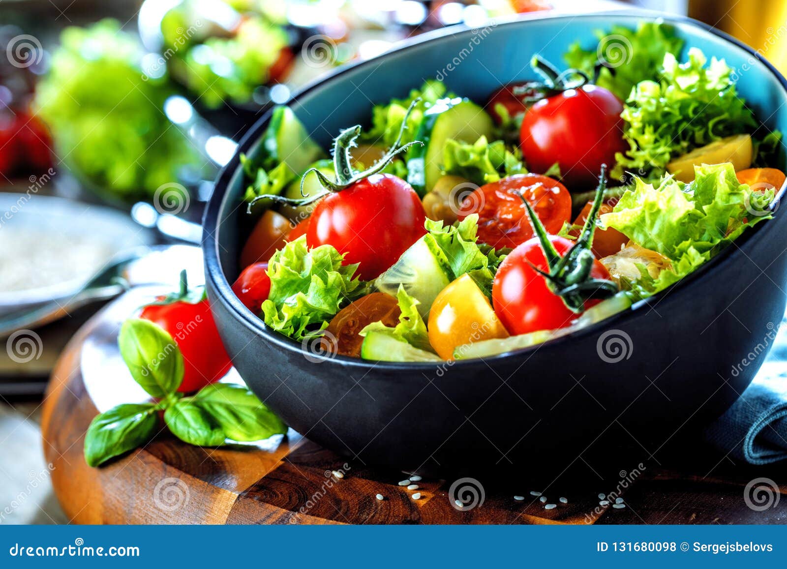 Vegetable Salad Bowl on Kitchen Table. Balanced Diet Stock Photo