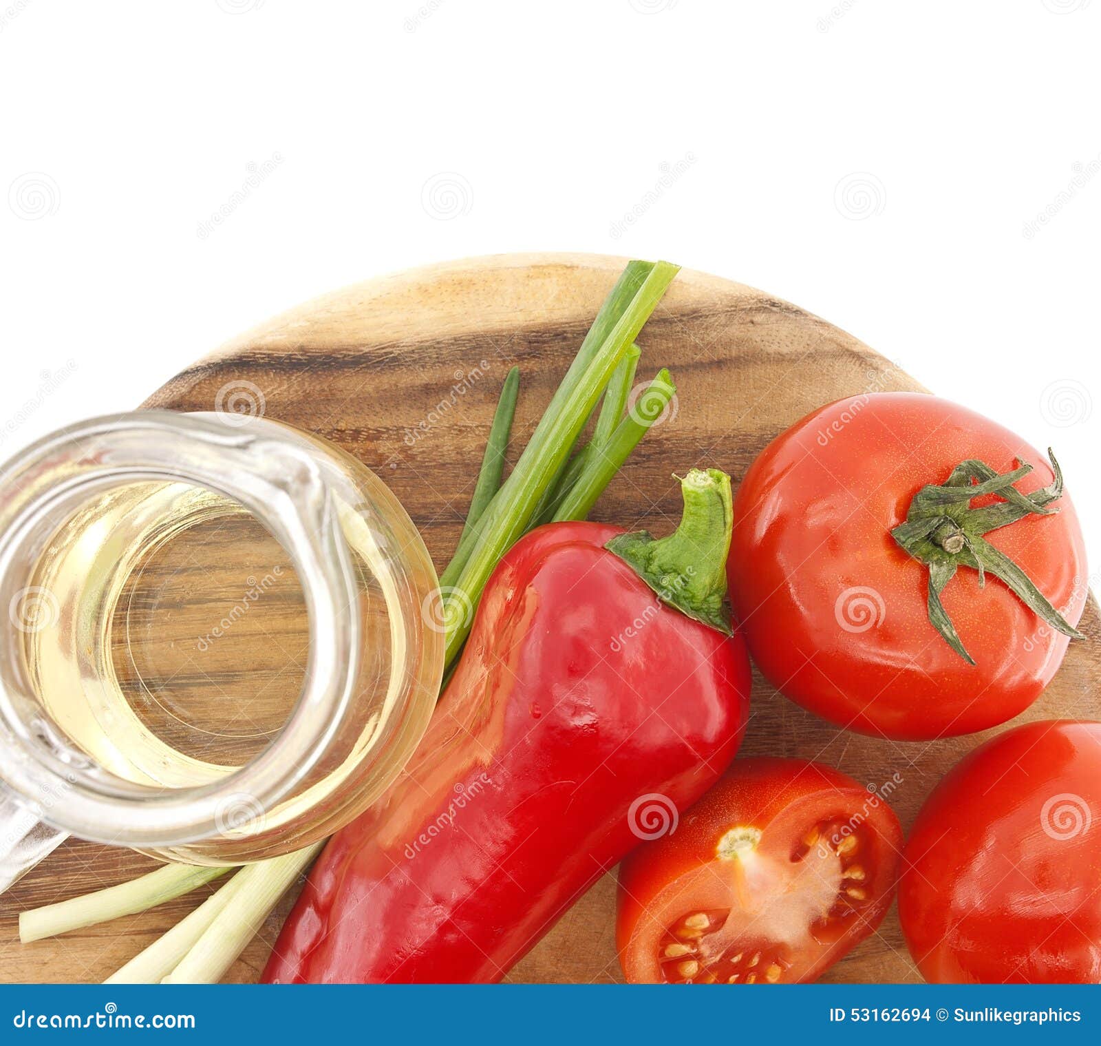 Vegetables and Oil on Cutting Board, on White Stock Photo Image of