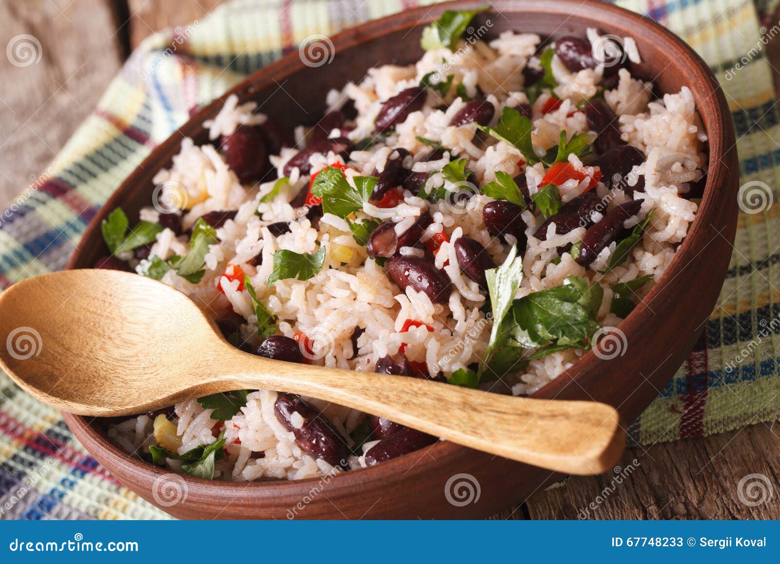 vegetarian food: rice with red beans in a bowl close-up. horizon