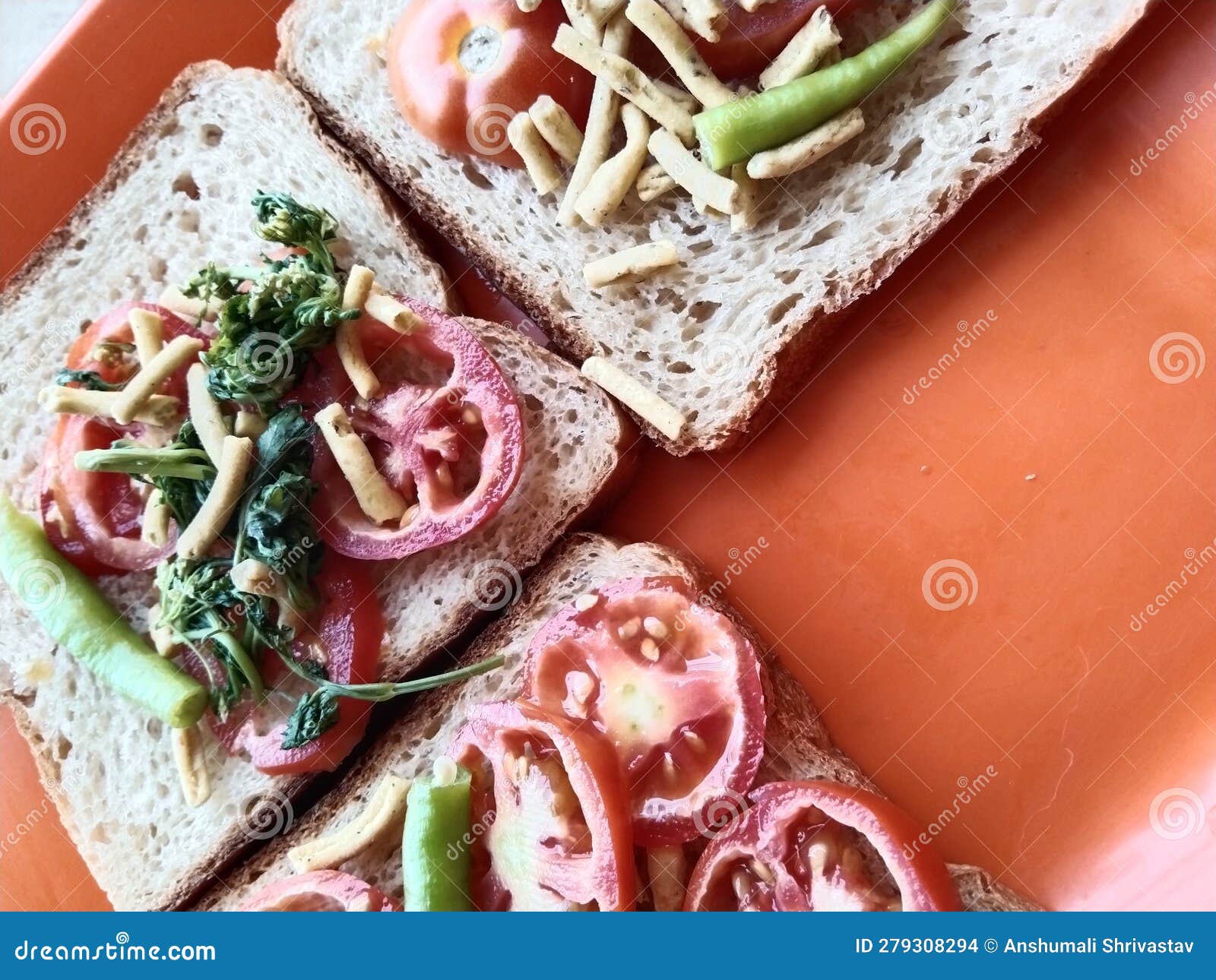 Vegetarian Sandwich Made Up of Bread, Tomatoes and Coriander Leaves