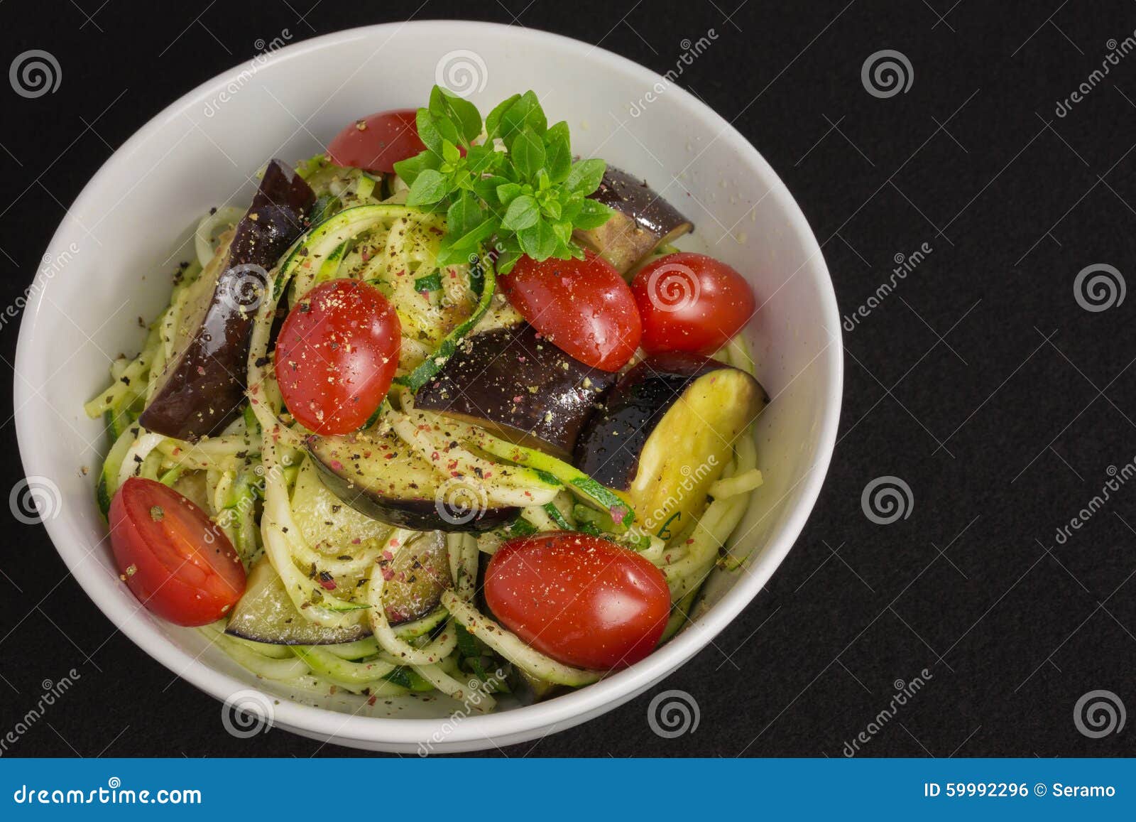 Vegetarian Zucchini Noodles with Tomatoes and Eggplant Stock Photo