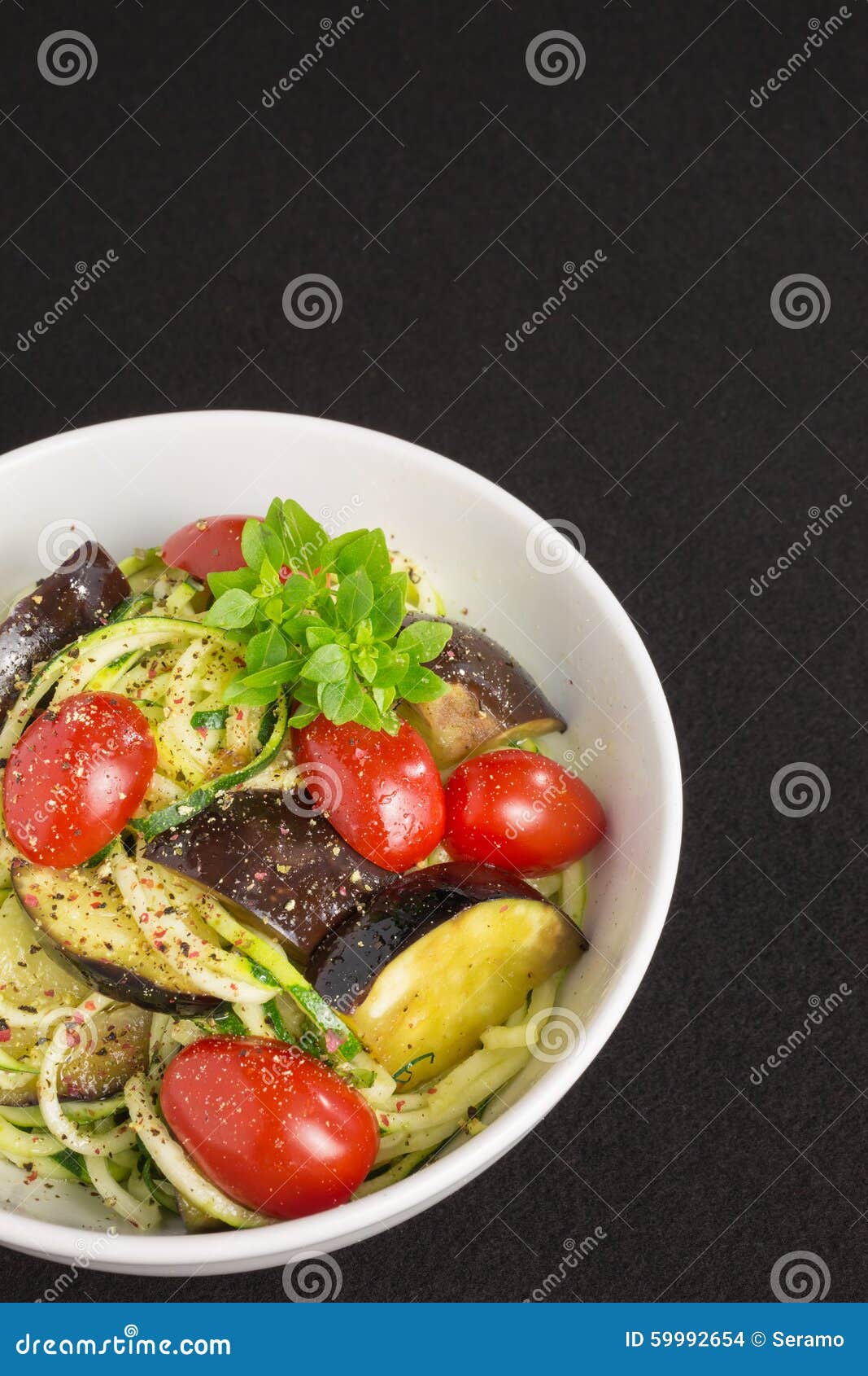 Vegetarian Zucchini Noodles with Tomatoes and Eggplant Stock Photo