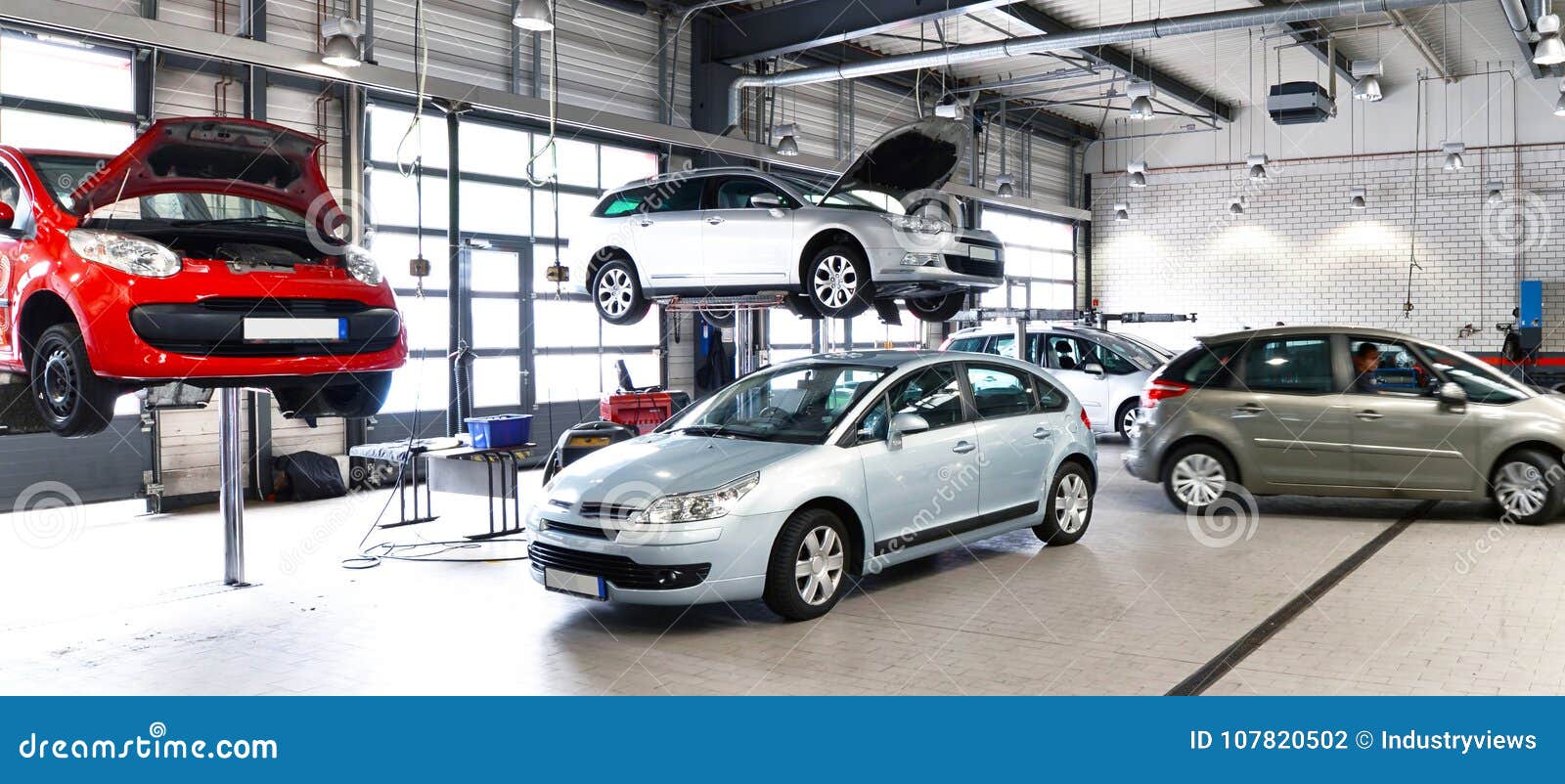 vehicles in a car repair shop for the repair with lifting platform