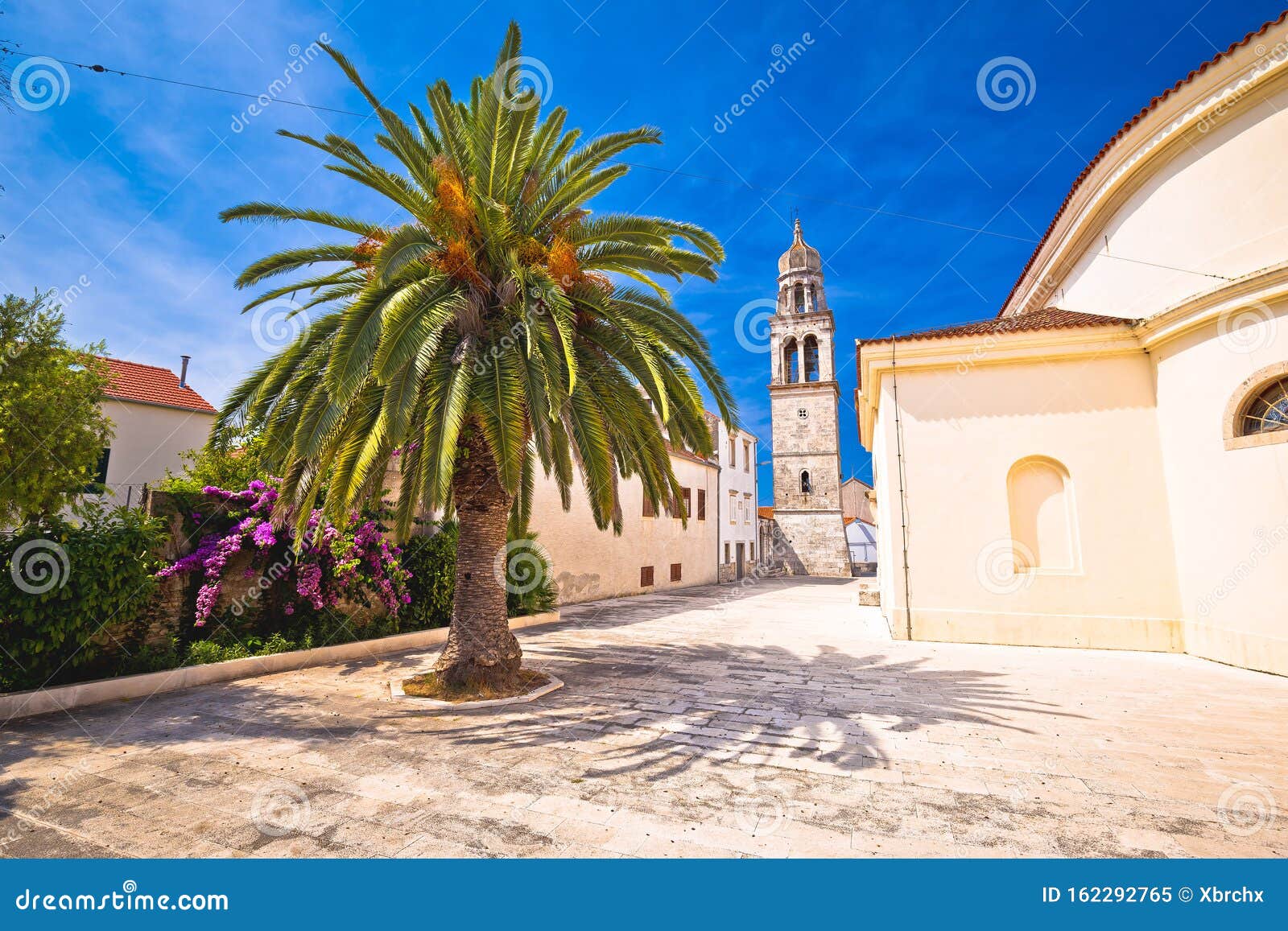 vela luka: town of vela luka on korcula island church and old stone square view