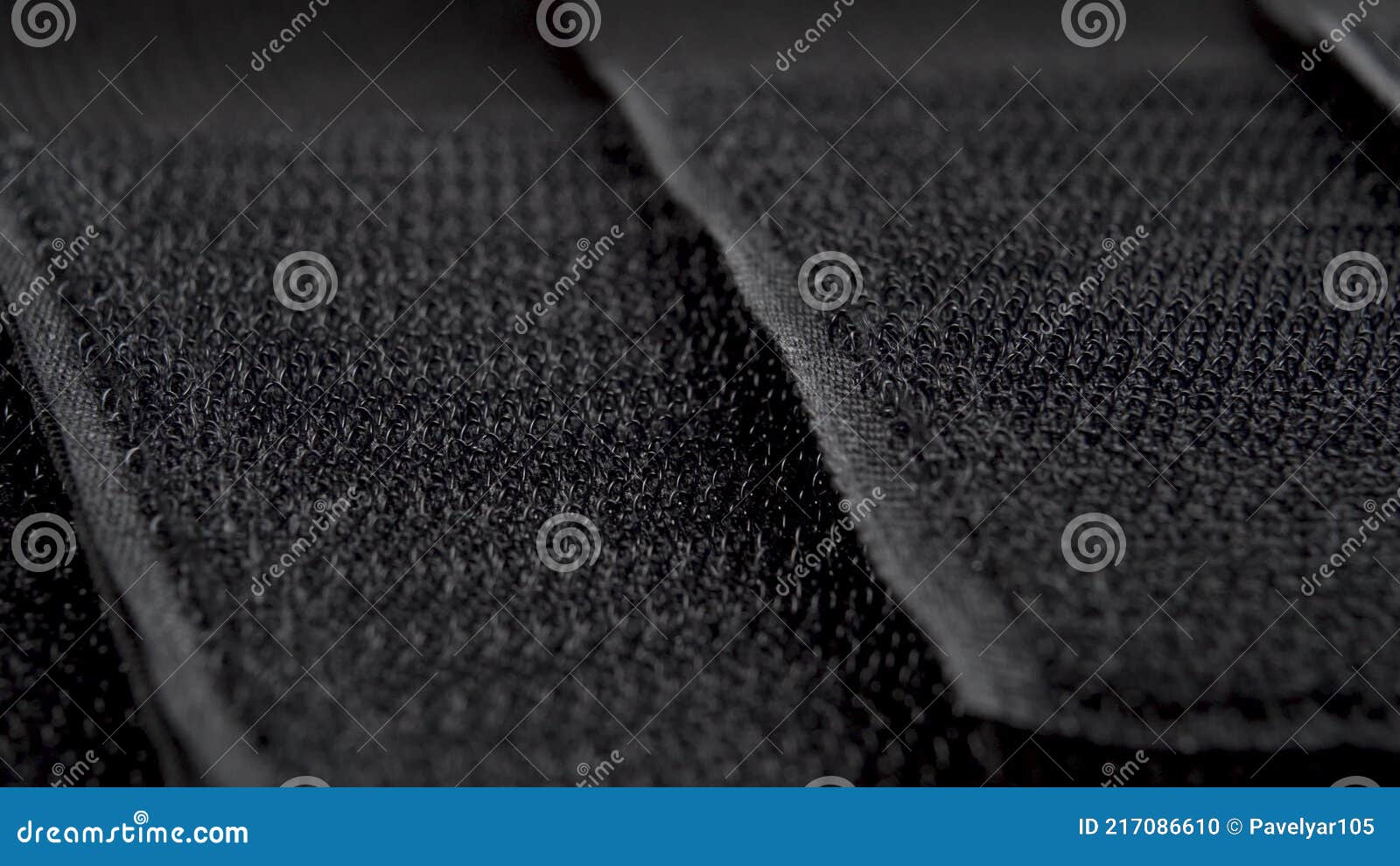 Velcro on Black Textile Tapes Close-up. Textured Abstract Dark