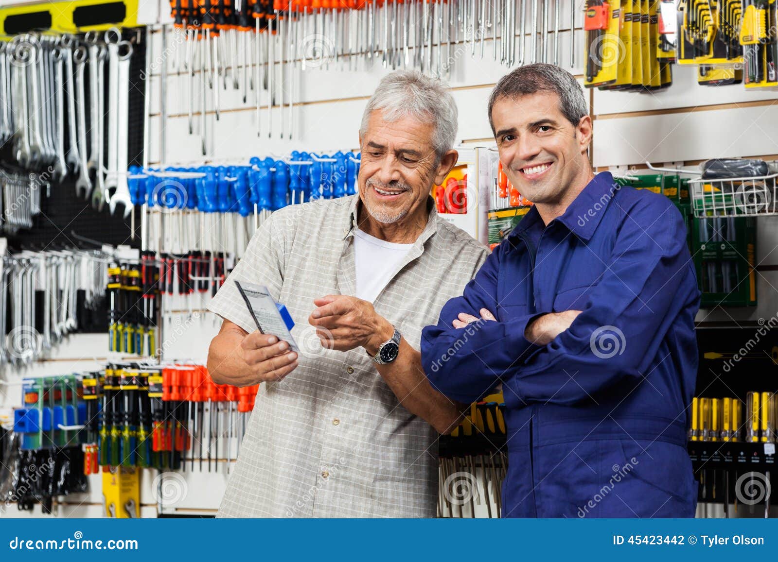 Vendor with Customer Holding Packed Tool Stock Photo Image of buying