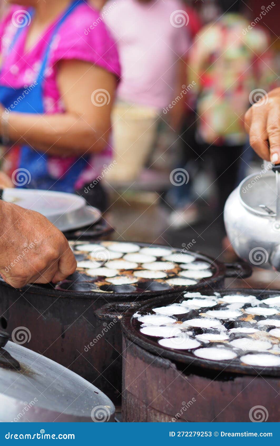 Vendors Prepare Traditional Snacks To Sell at a Market. Stock Image