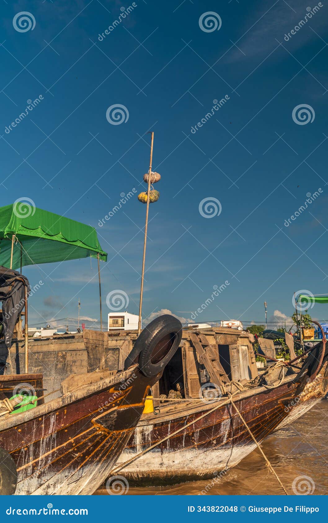 vendors and their boats at the floating market of cai reng in vietnam early in the morning