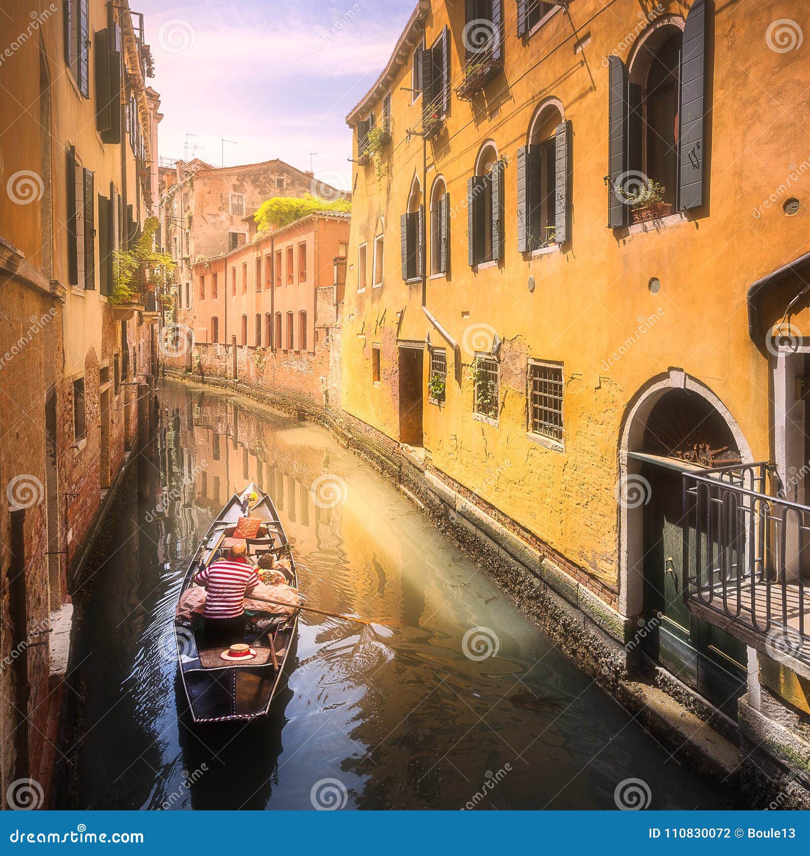 venecia canal with boats and gondolas, italy