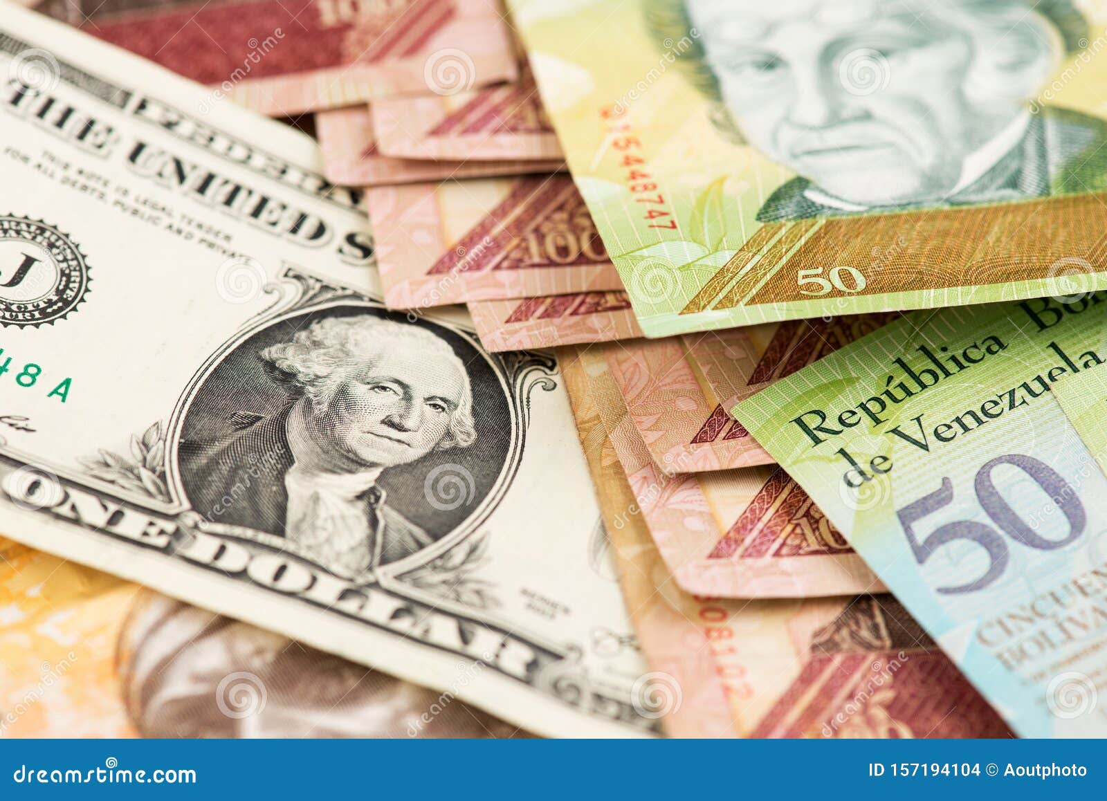 One Dollar Bill And Venezuelan Currency Bolivar Fuerte