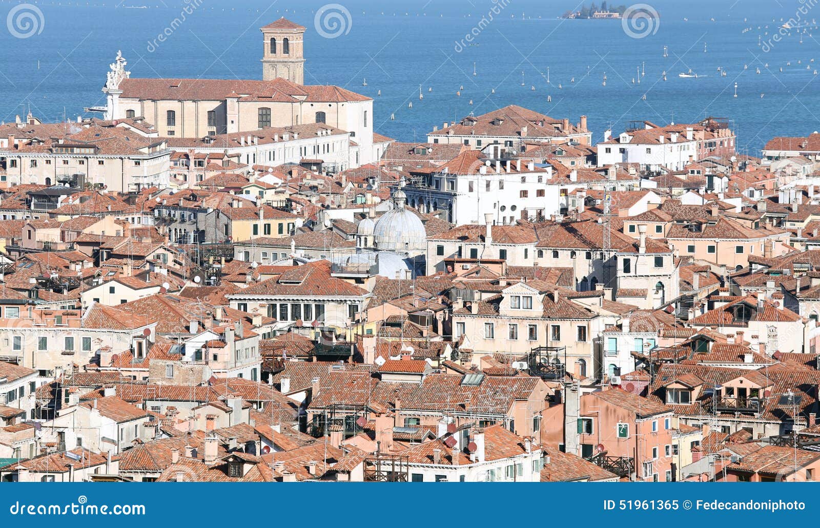 venice, italy, red-tiled roofs of the houses and the church