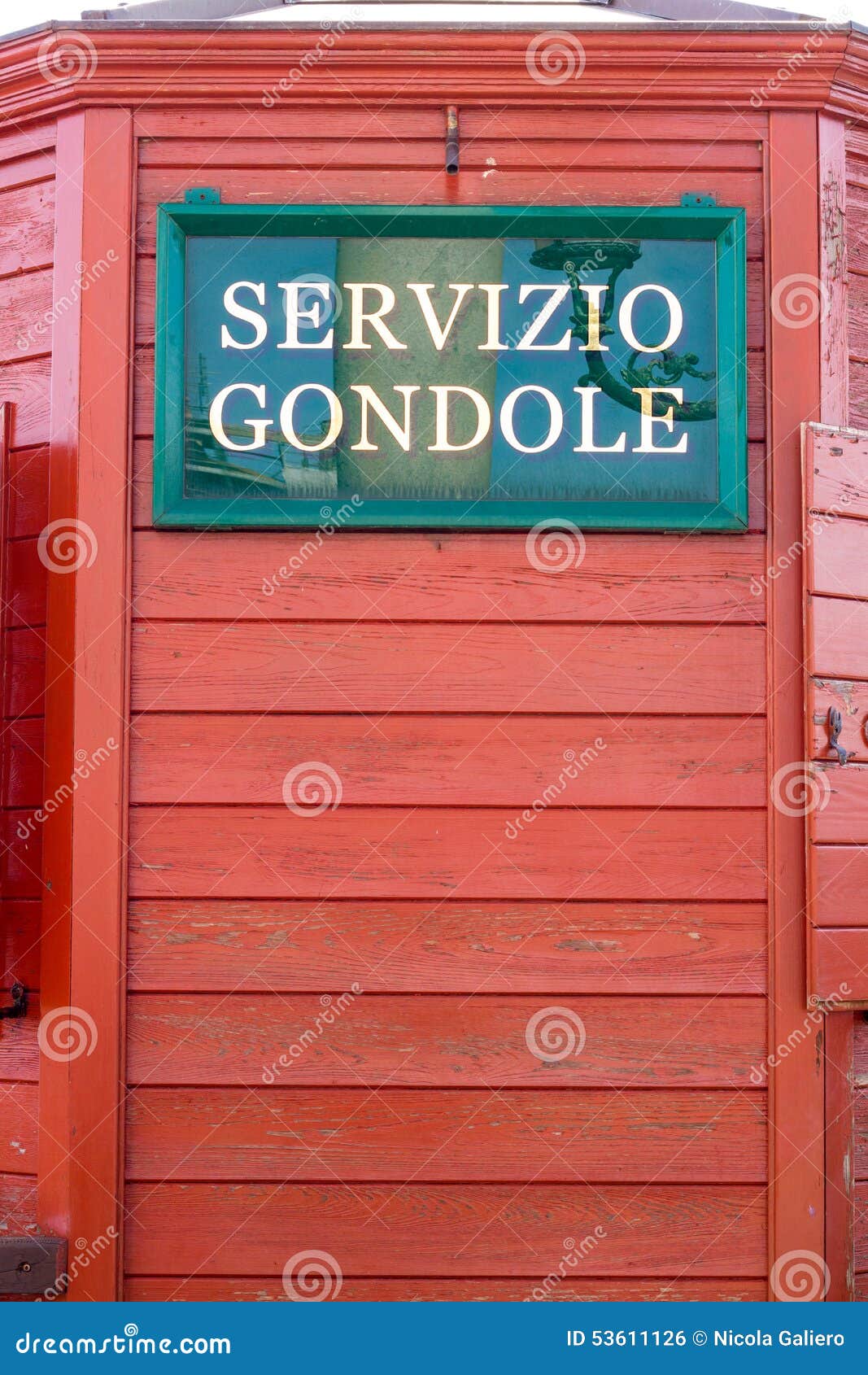 venice italy sign advertising servicio gondole (gondola service) with red wood background