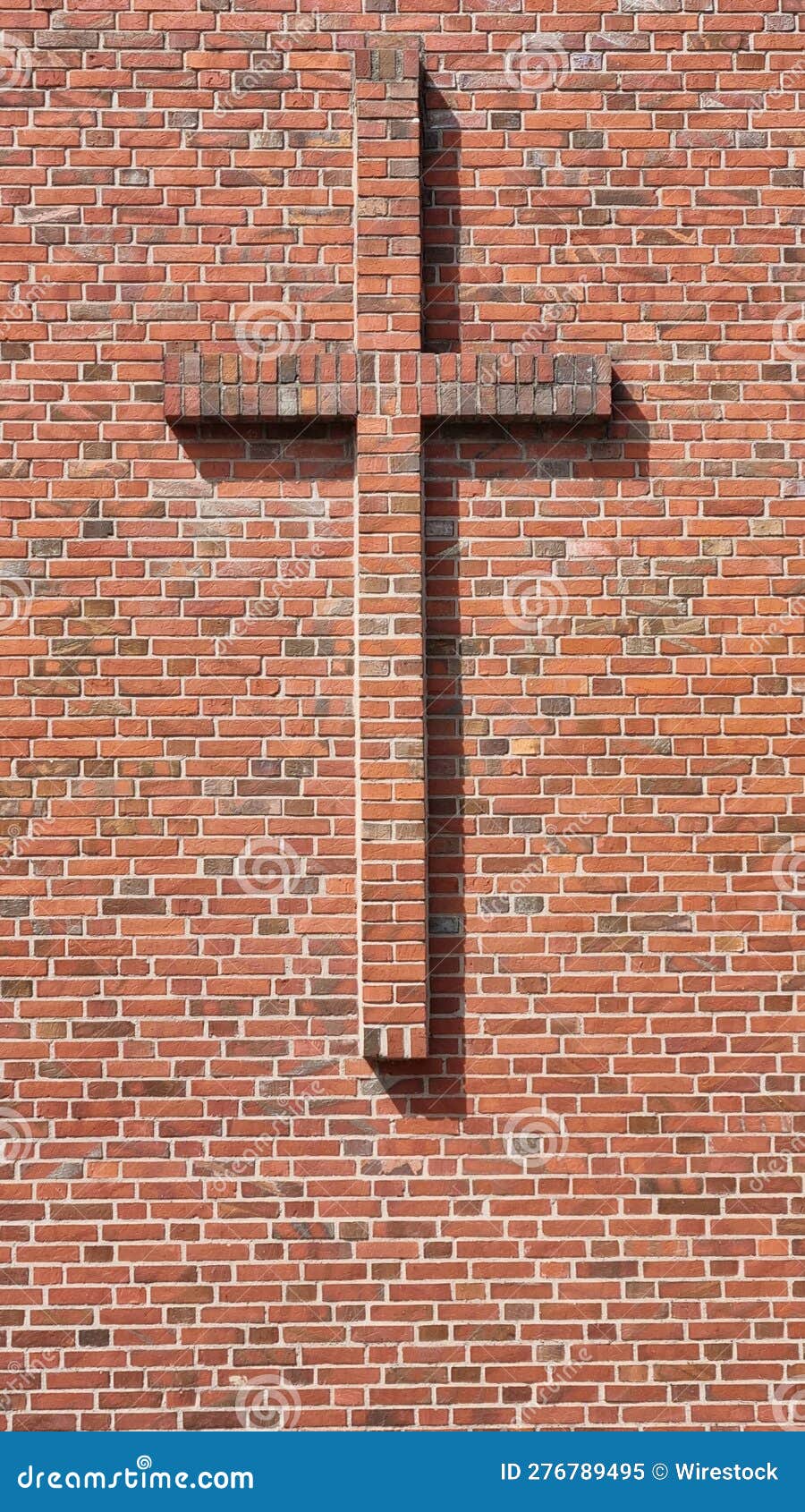 Vertical of a Brick Cross on a Wall of a Building Stock Illustration