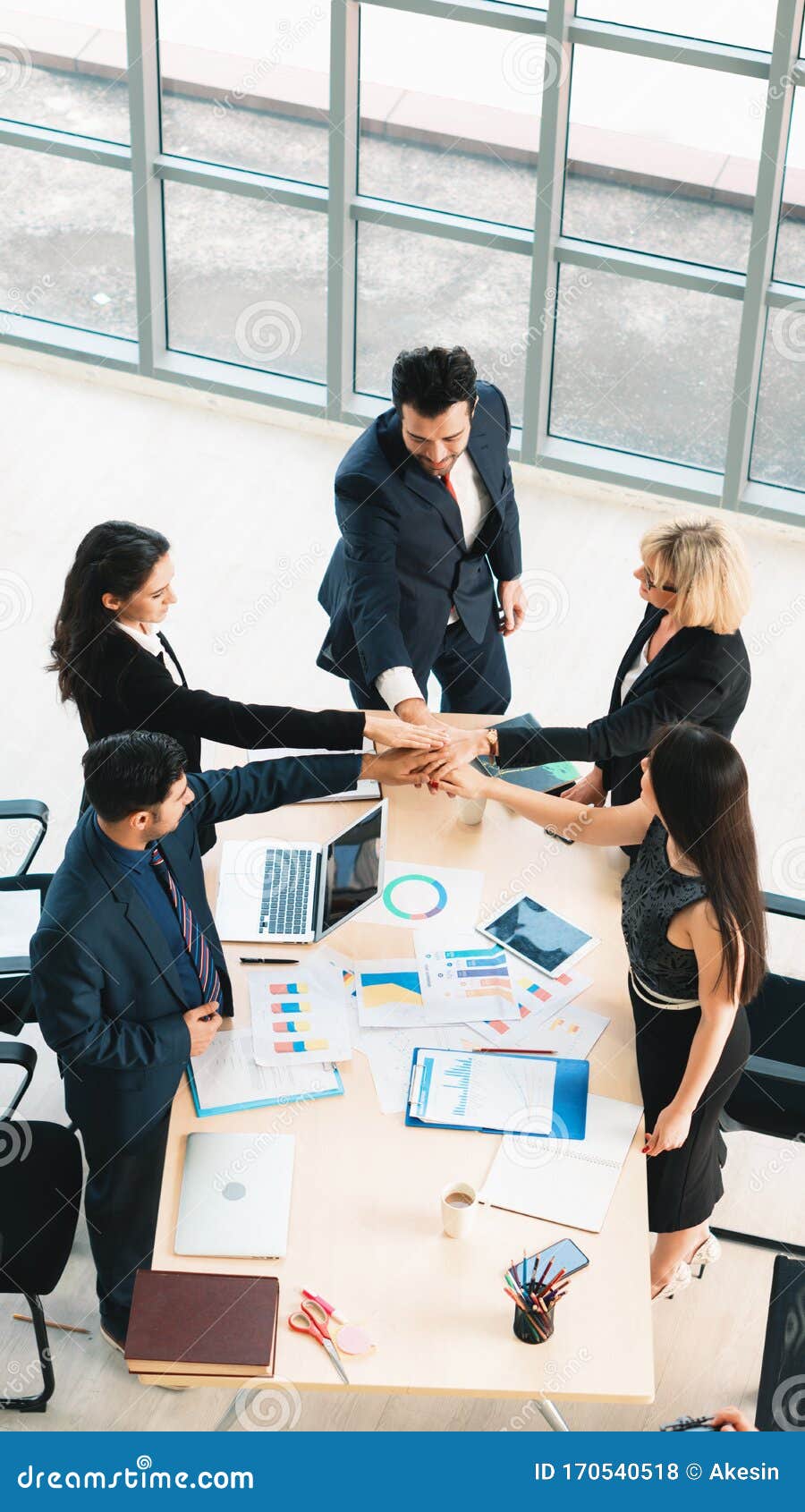 Vertical Business Background Of Group Of Business People Having Hand