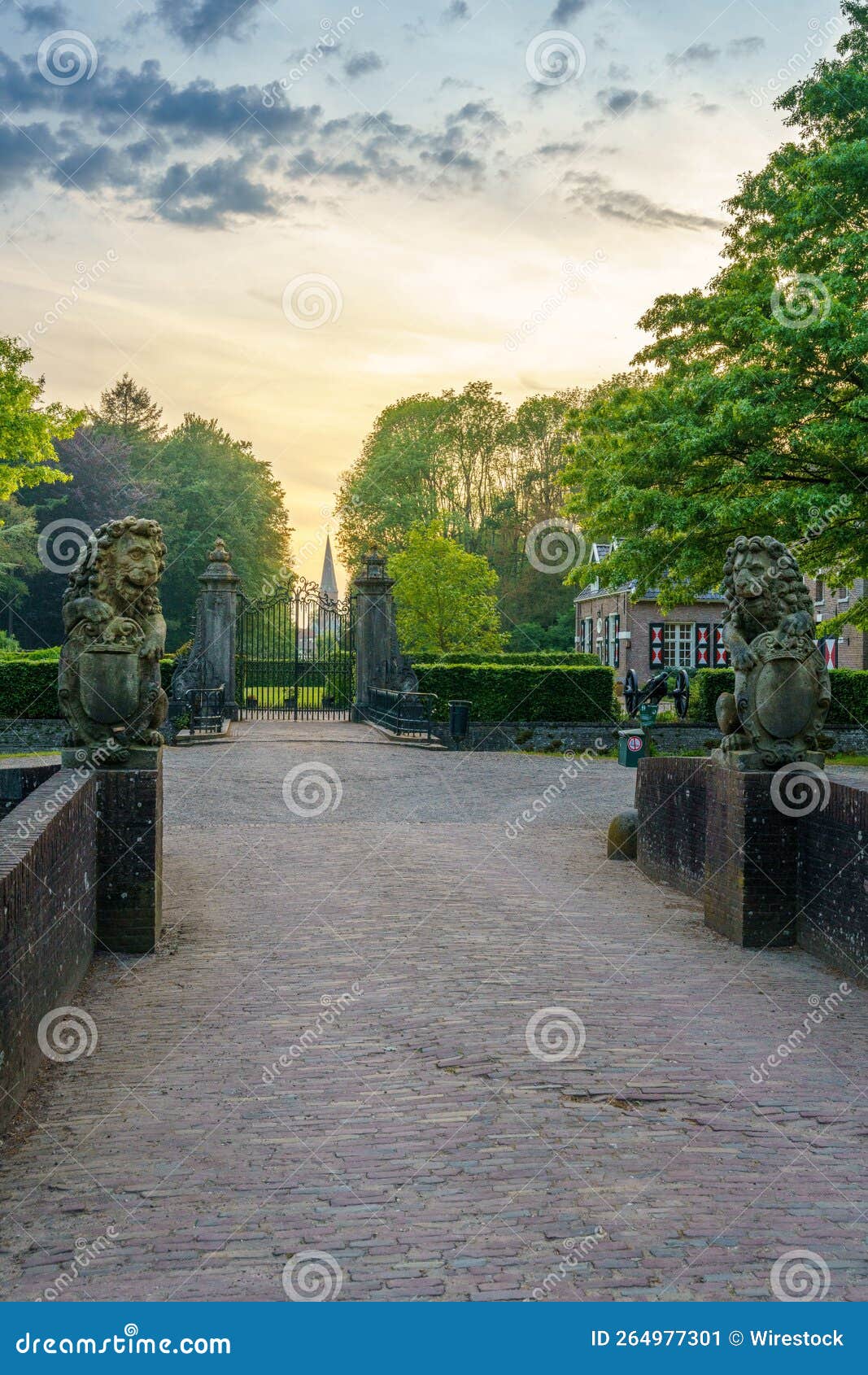 Vertical Closeup Shot of a Pathway in an Old Park with Statues, on a