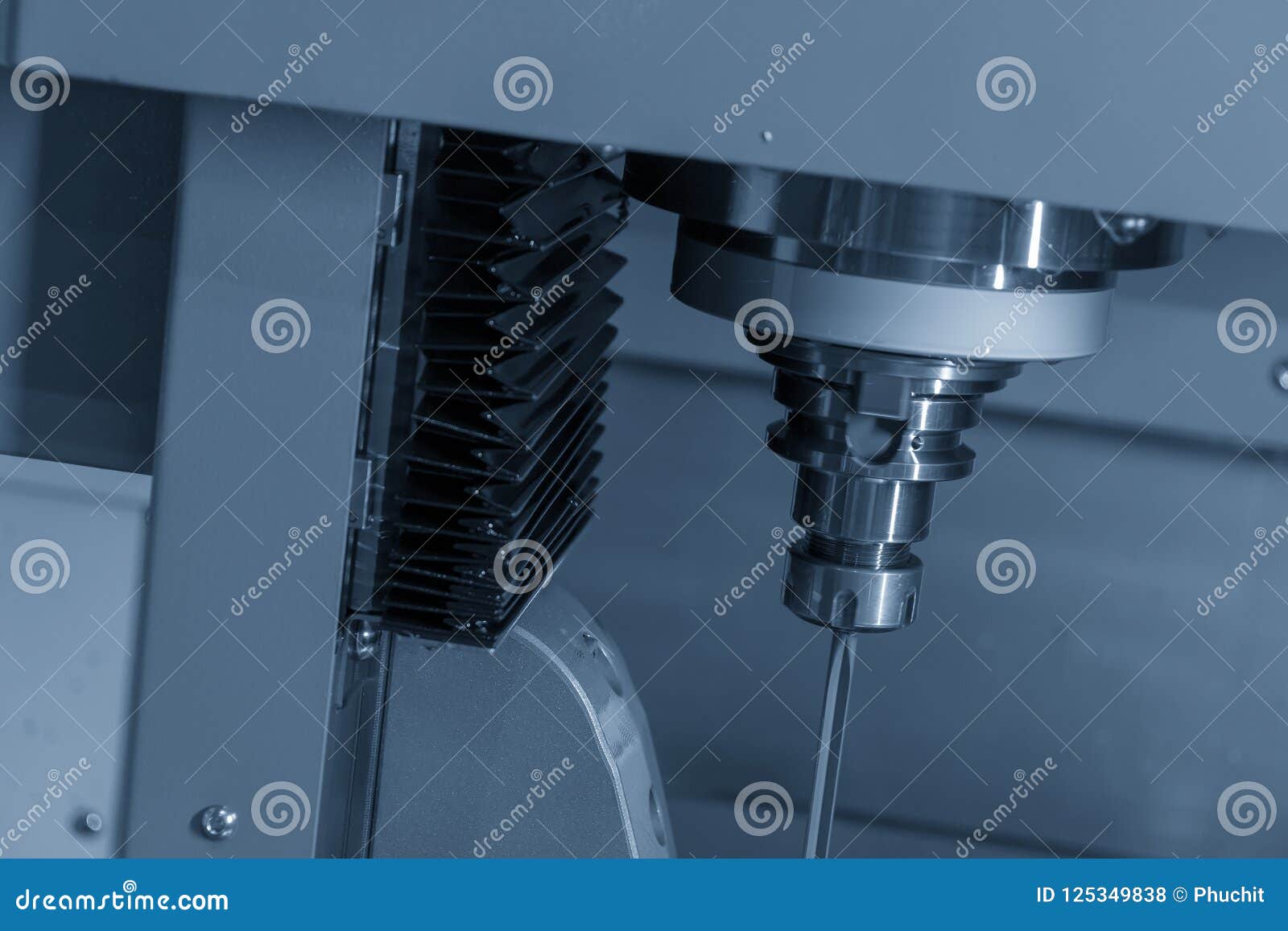 The Vertical CNC Gundrill Machine Drilling the Mold Part . Stock Photo