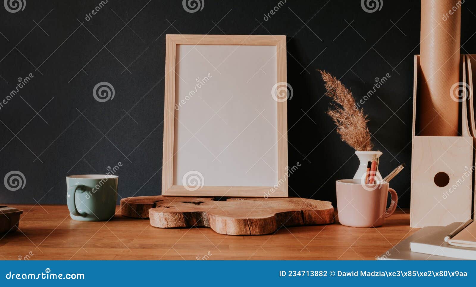 vertical empty frame stanting on wooden slice