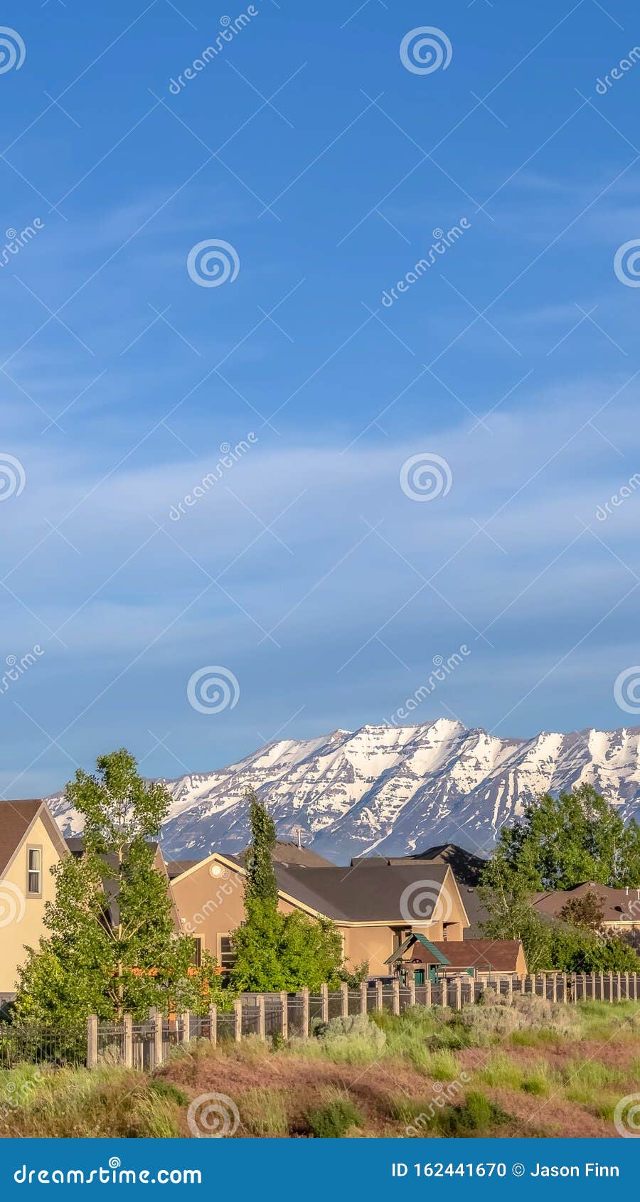 Vertical Frame Houses on a Hill Overlooking a Magnificent Distant ...