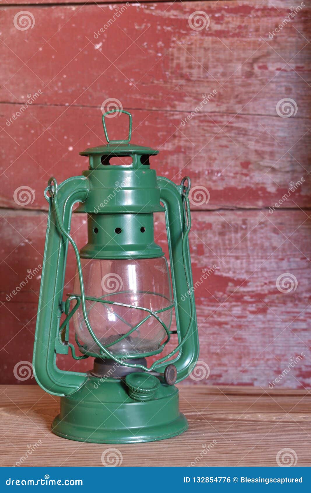 A Green Oil Lamp on Red Barn Board Stock Photo Image of antique