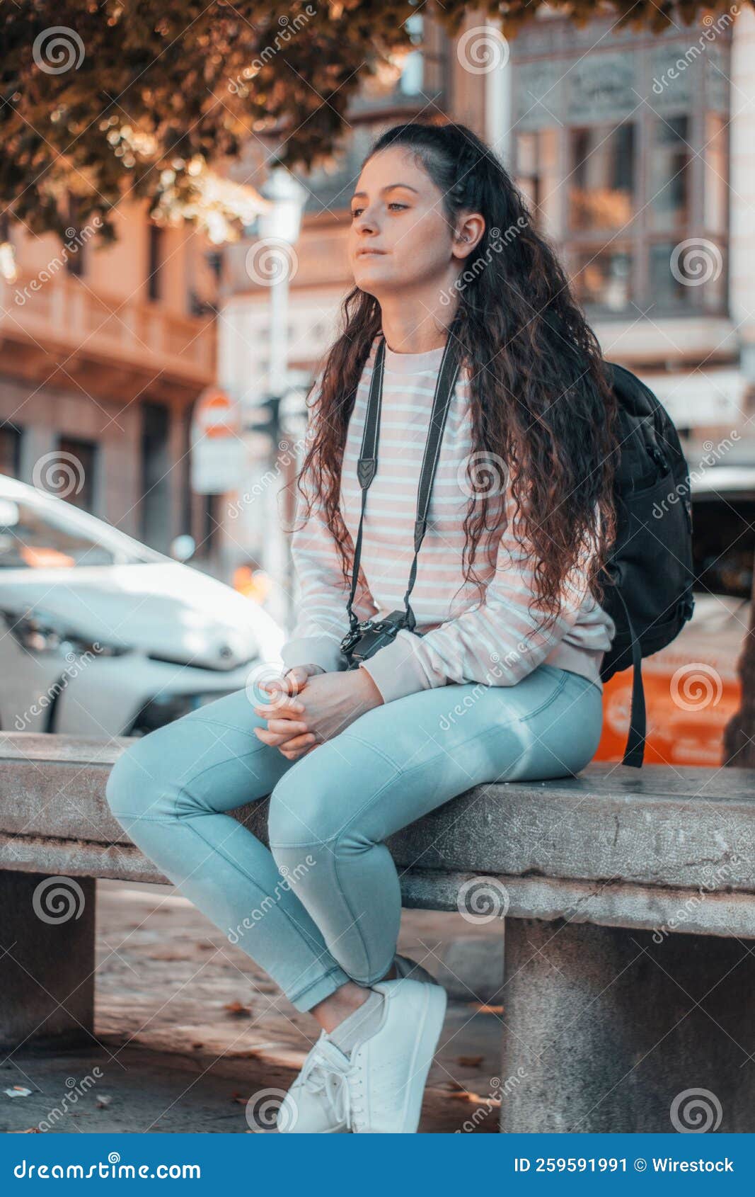 Vertical Shot of a Beautiful Girl Posing in the Street on a Sunny Day ...