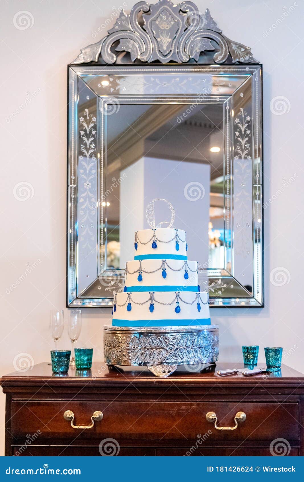Vertical Shot Of A Beautiful White And Blue Wedding Cake On A Table Under A Mirror Stock Photo Image Of Birthday Bakery 181426624
