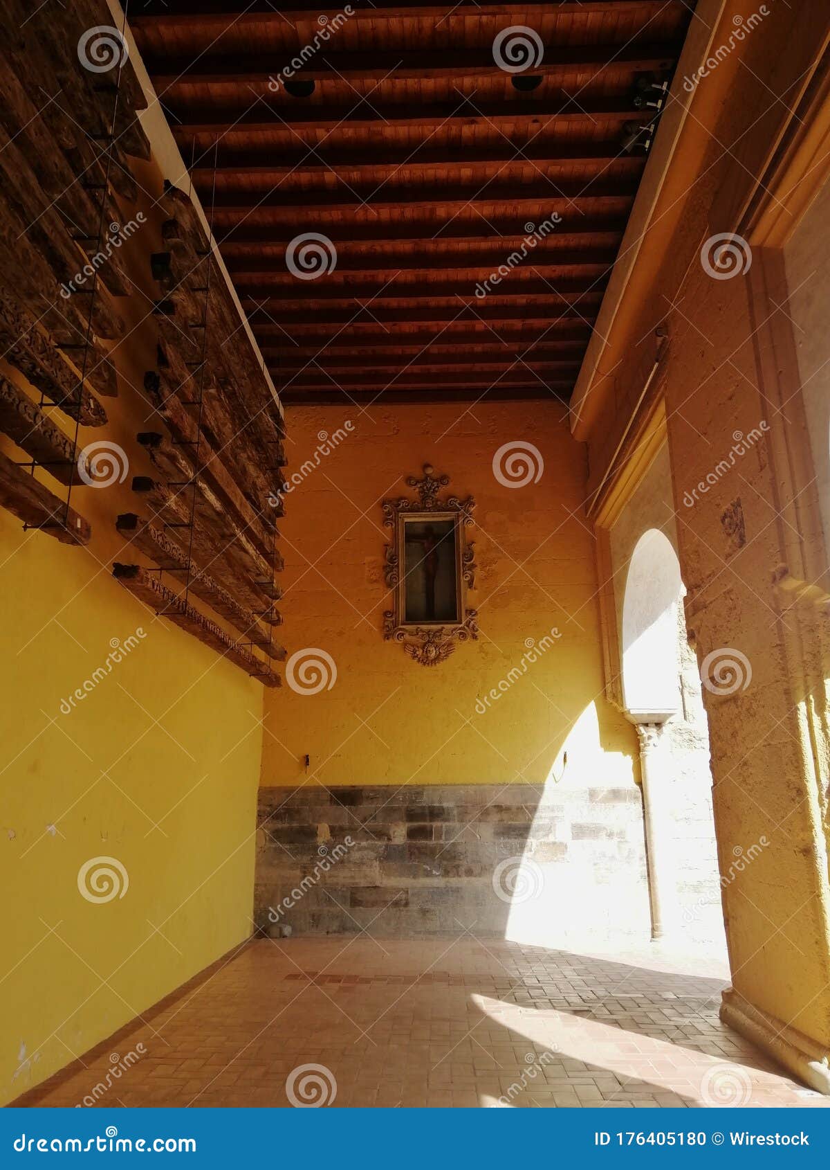 vertical shot of a cross displayed in the wall of a building in  cÃÂ³rdoba, spain