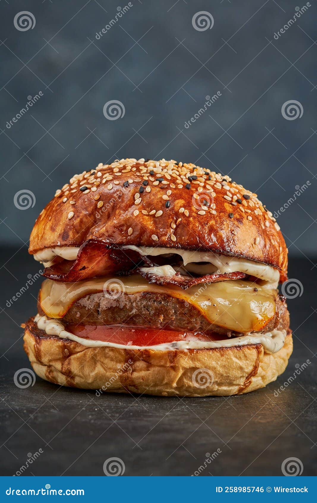 Vertical Shot of a Delicious Burger with Meat and Fried Bacon with