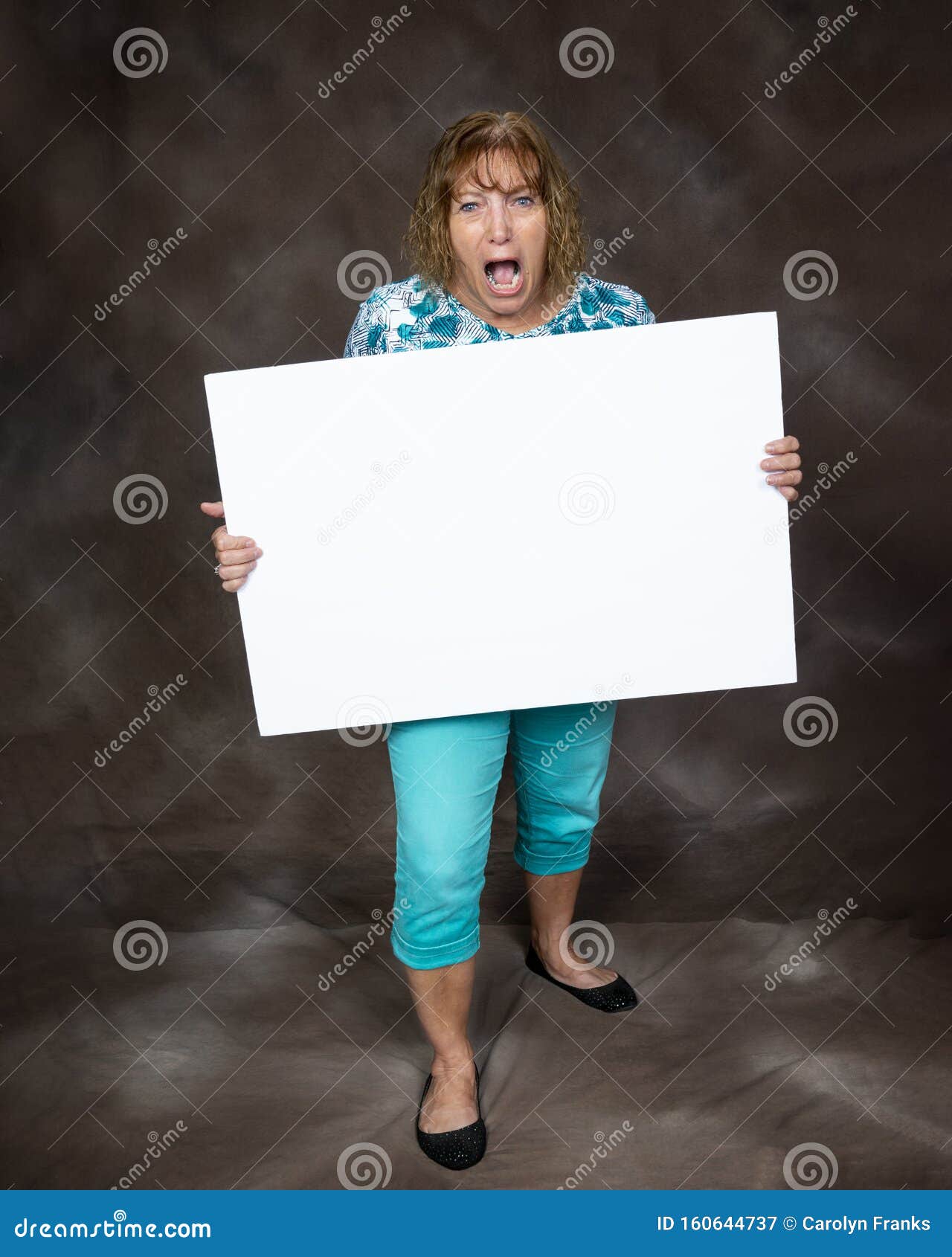 furious screaming woman holding blank sign