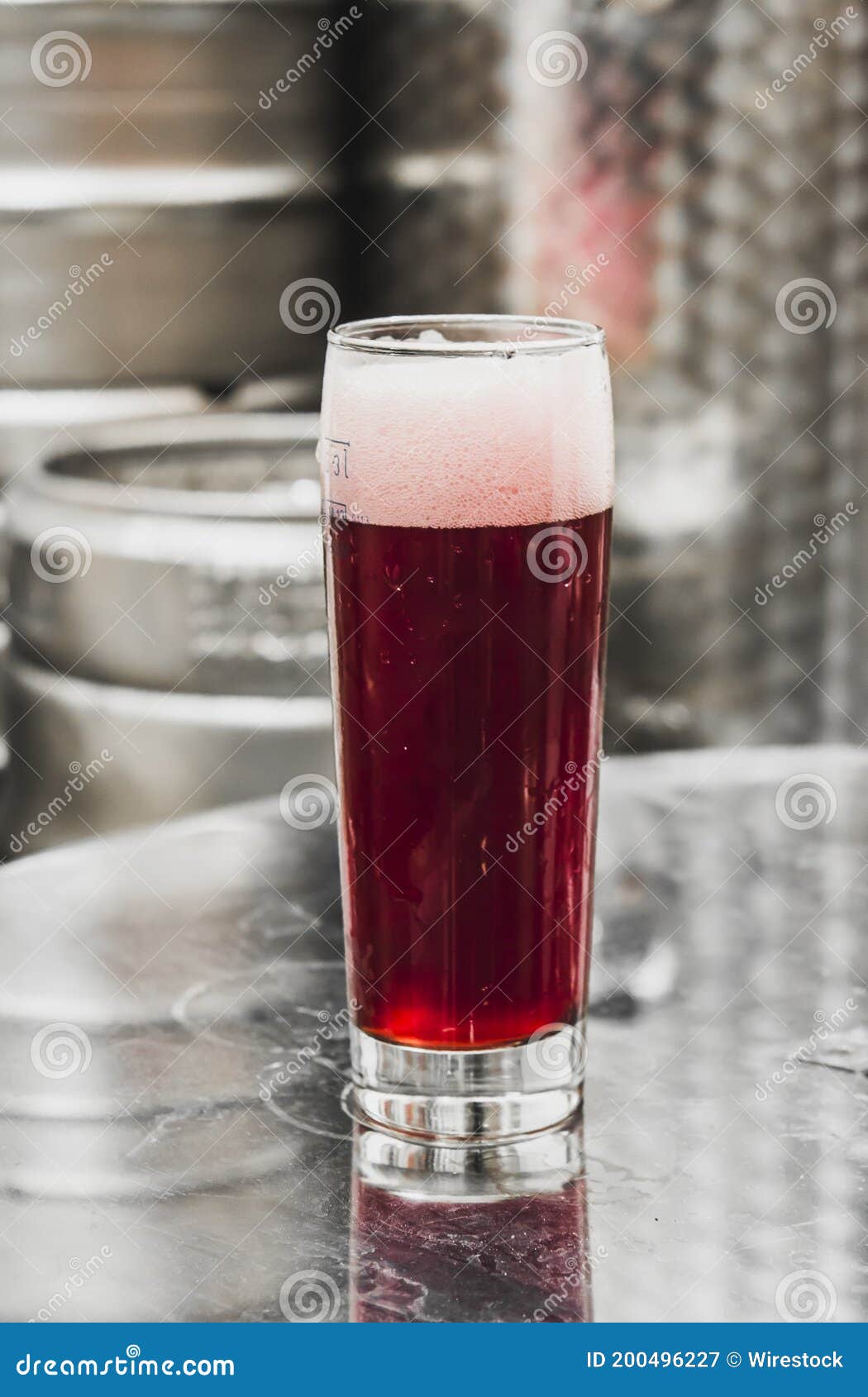 Vertical Shot of a Glass of Irish Red Ale in Craft Brewery Stock Image