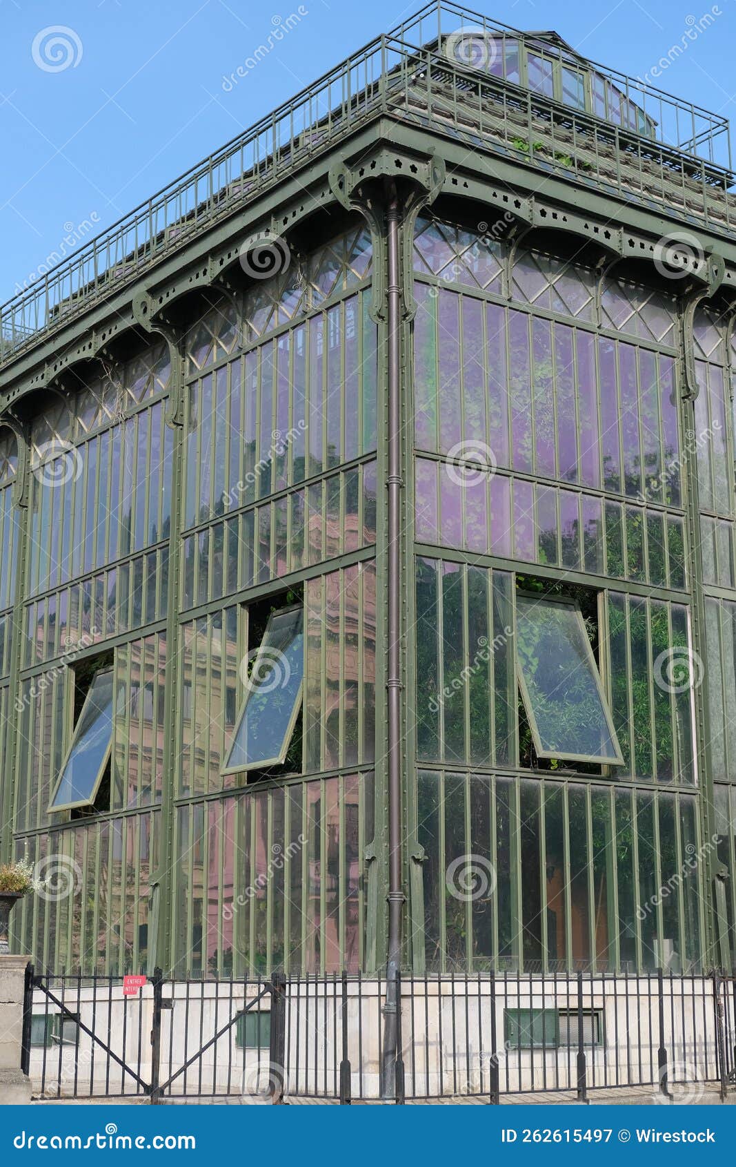 vertical shot of a greenhouse in the garden of plants in paris, france