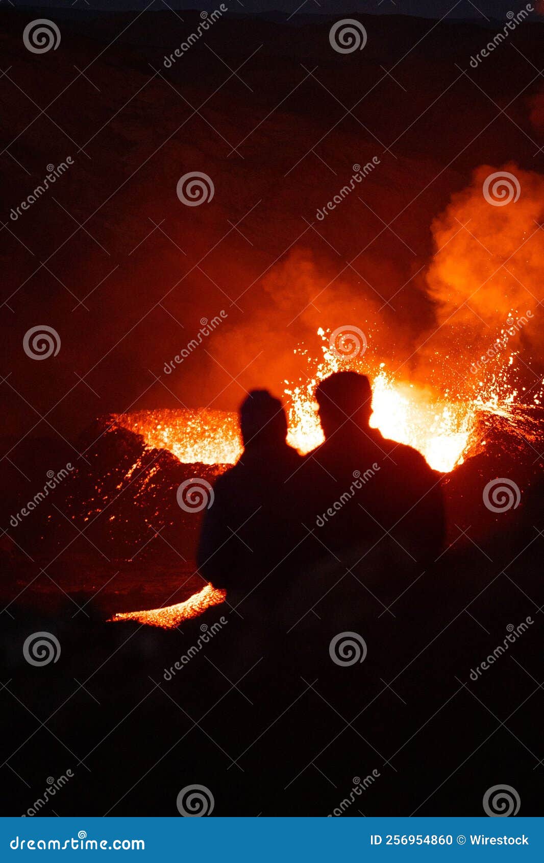 vertical shot of lava flowing over rocky surface during 2022 meradalir volcano eruption, iceland